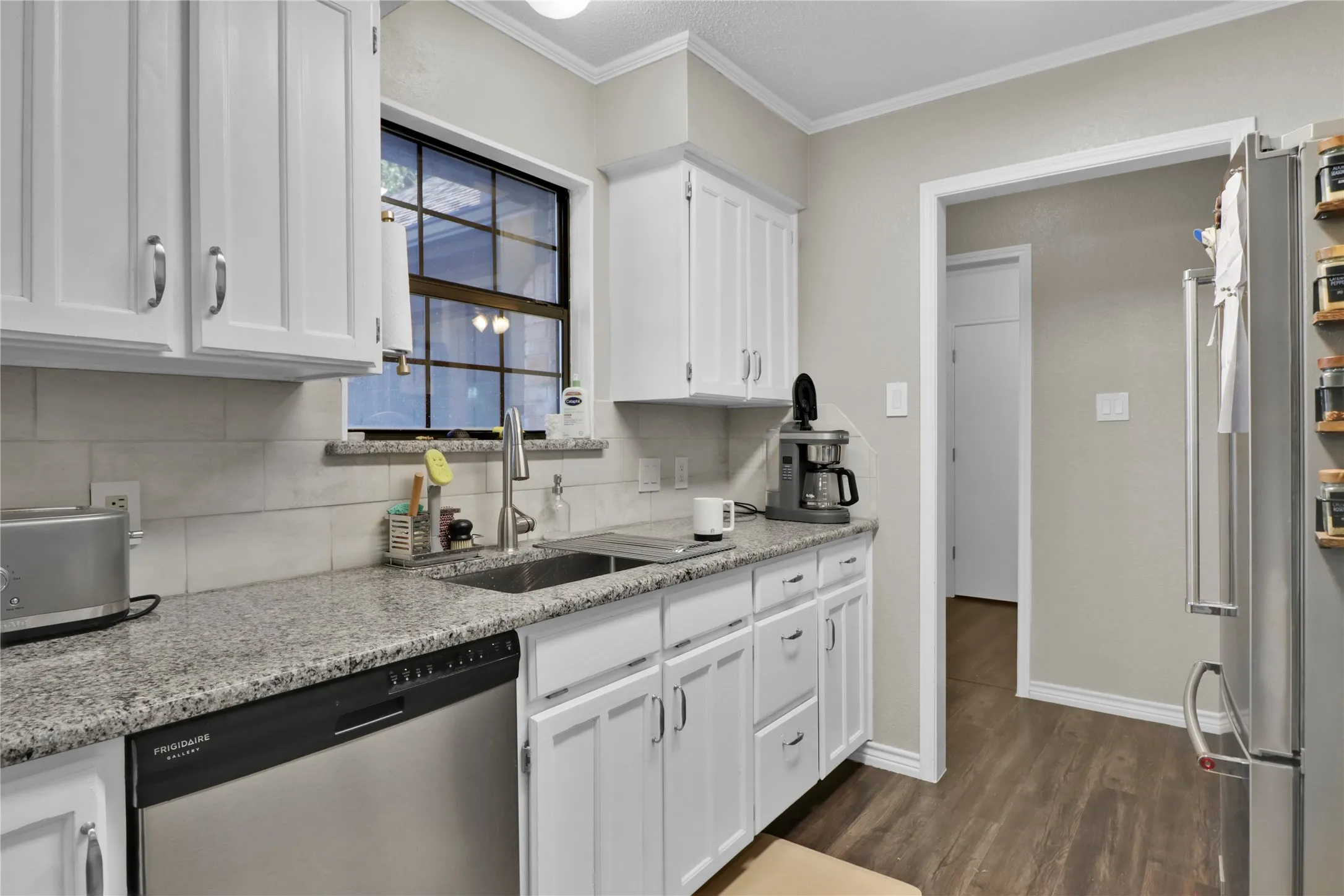 Kitchen window and neutral colors.