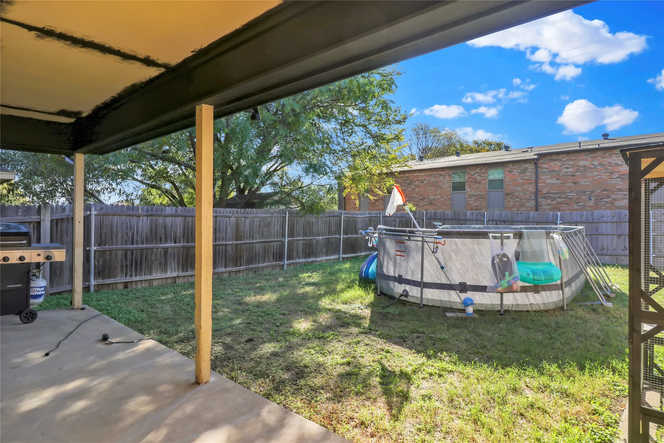 Covered patio. Liner to above ground pool is stored for winter. A brace on pool needs to be replaced. Buyer can keep or it can be removed.