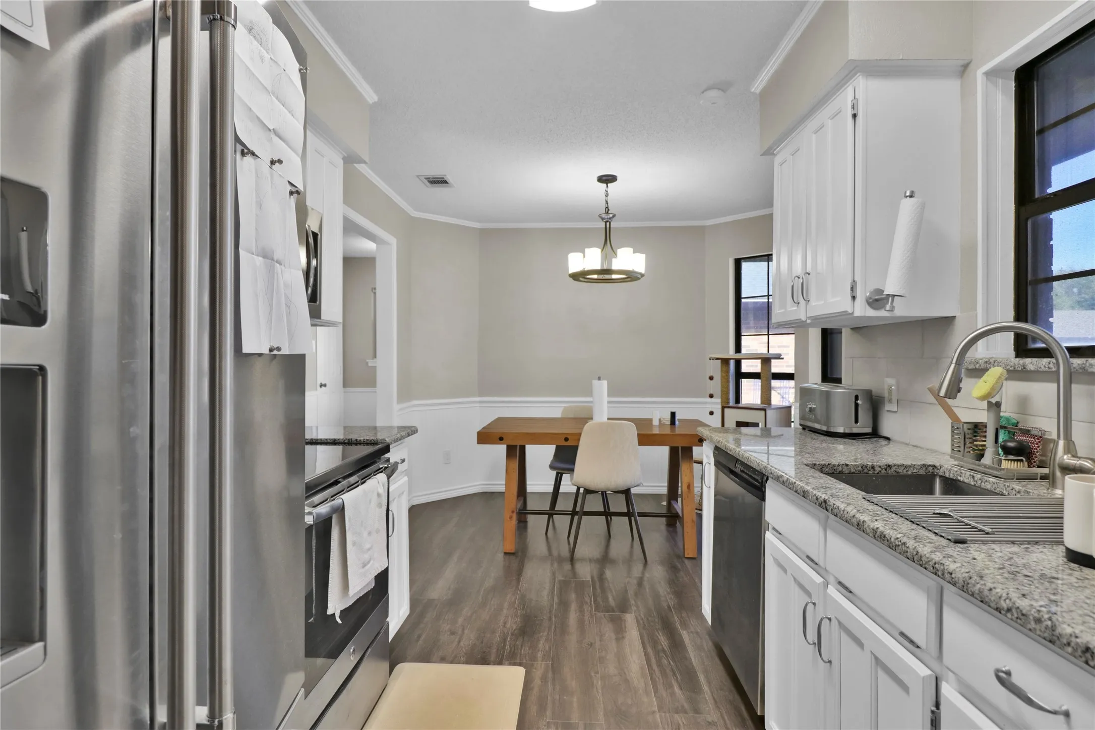 Kitchen with SS appliances.