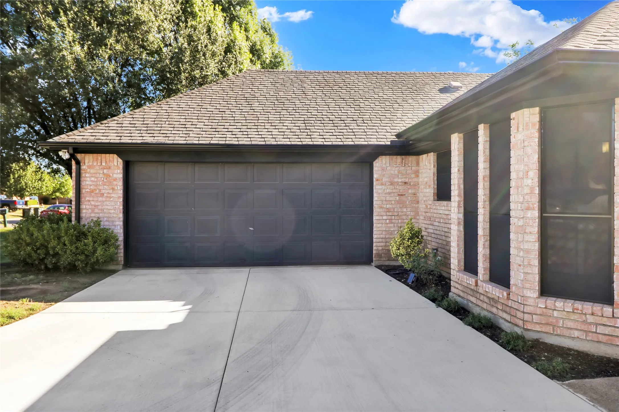 2 car garage. Swing drive allows for more parking space.