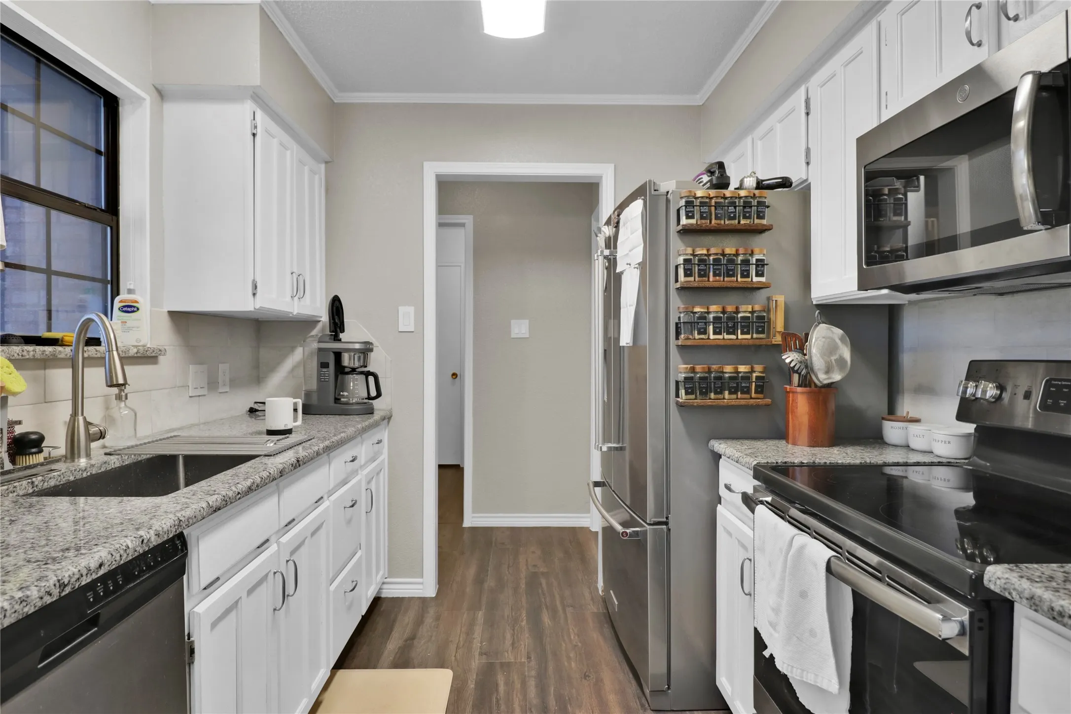 Straight ahead is utility room. Turn left to garage. Right to master suite.