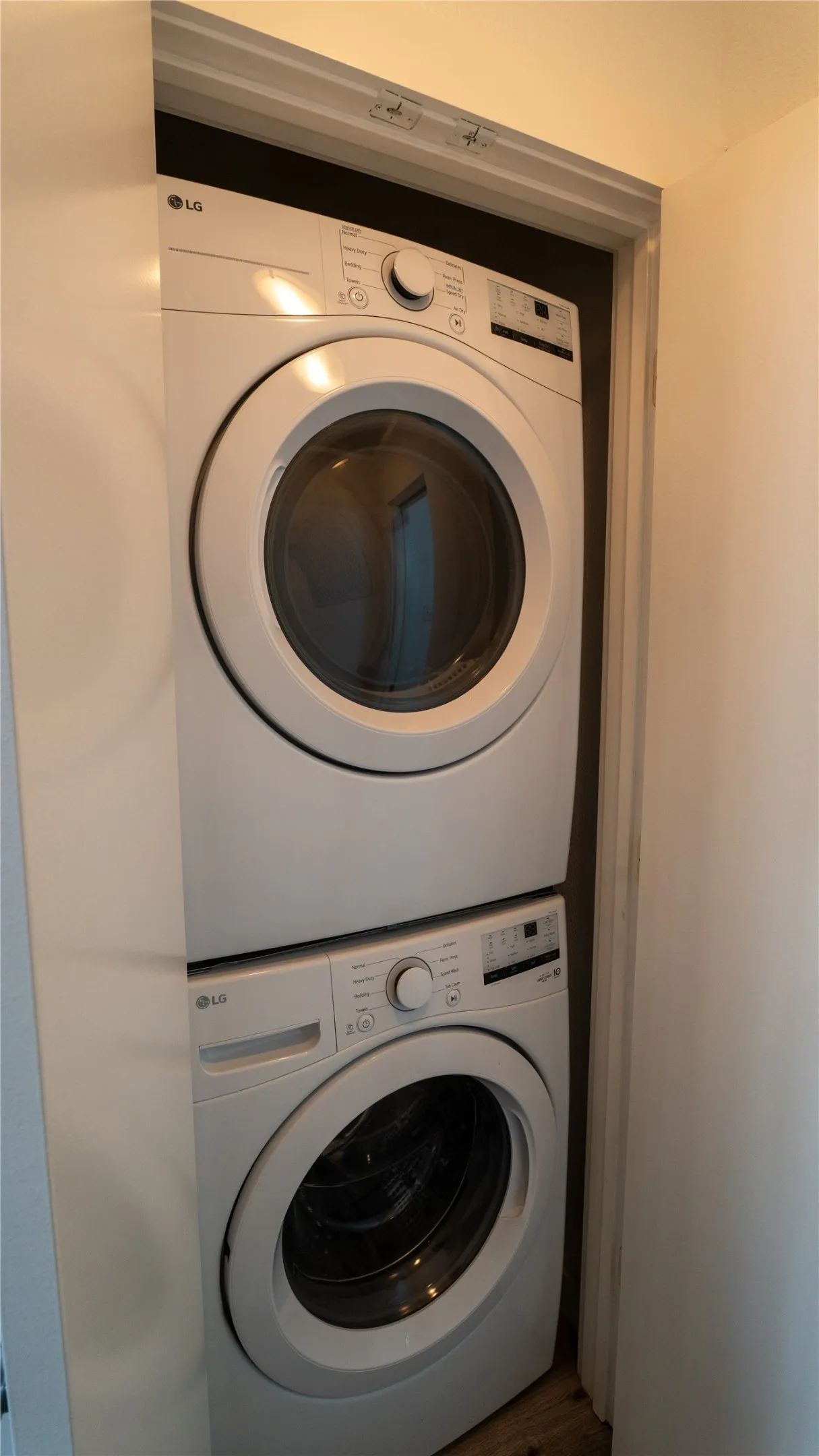 Stacked white LG front-loading washer and dryer unit