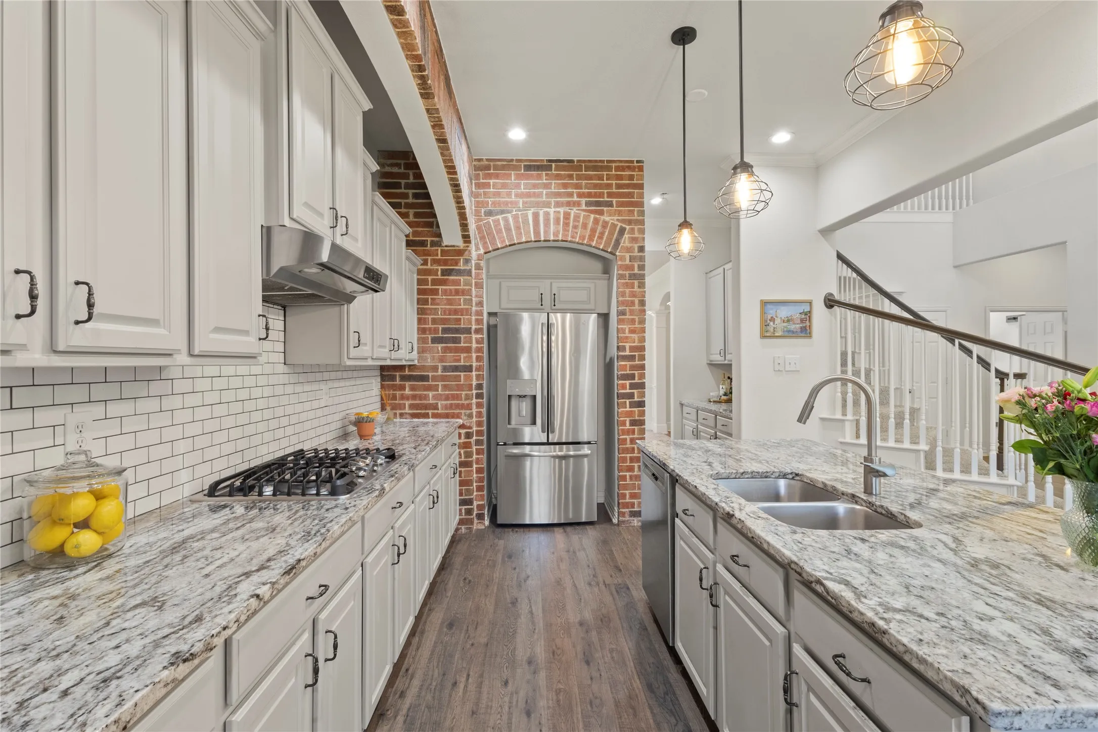 Neutral granite, brick accents, open concept