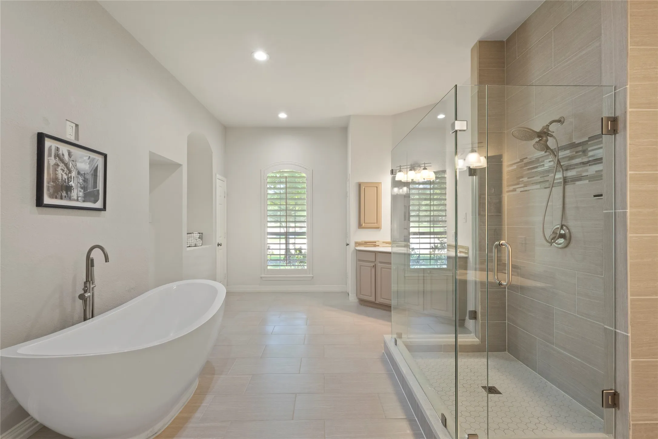 Soaking tub, separate sinks, New frameless shower,