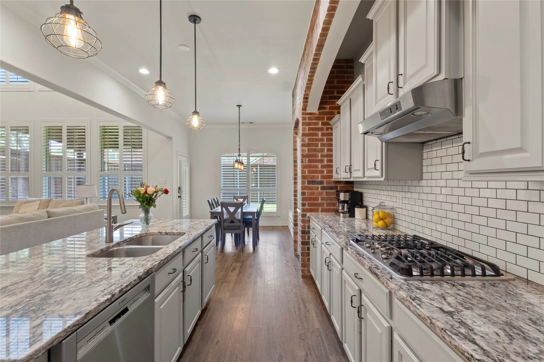 Open concept, subway tile, brick accent