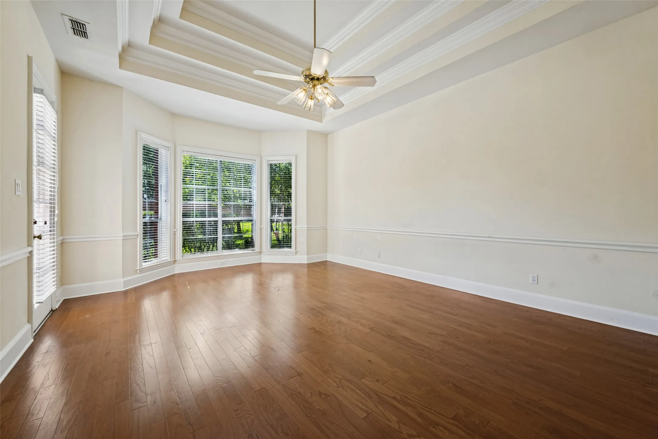 Primary bedroom overlooking backyard