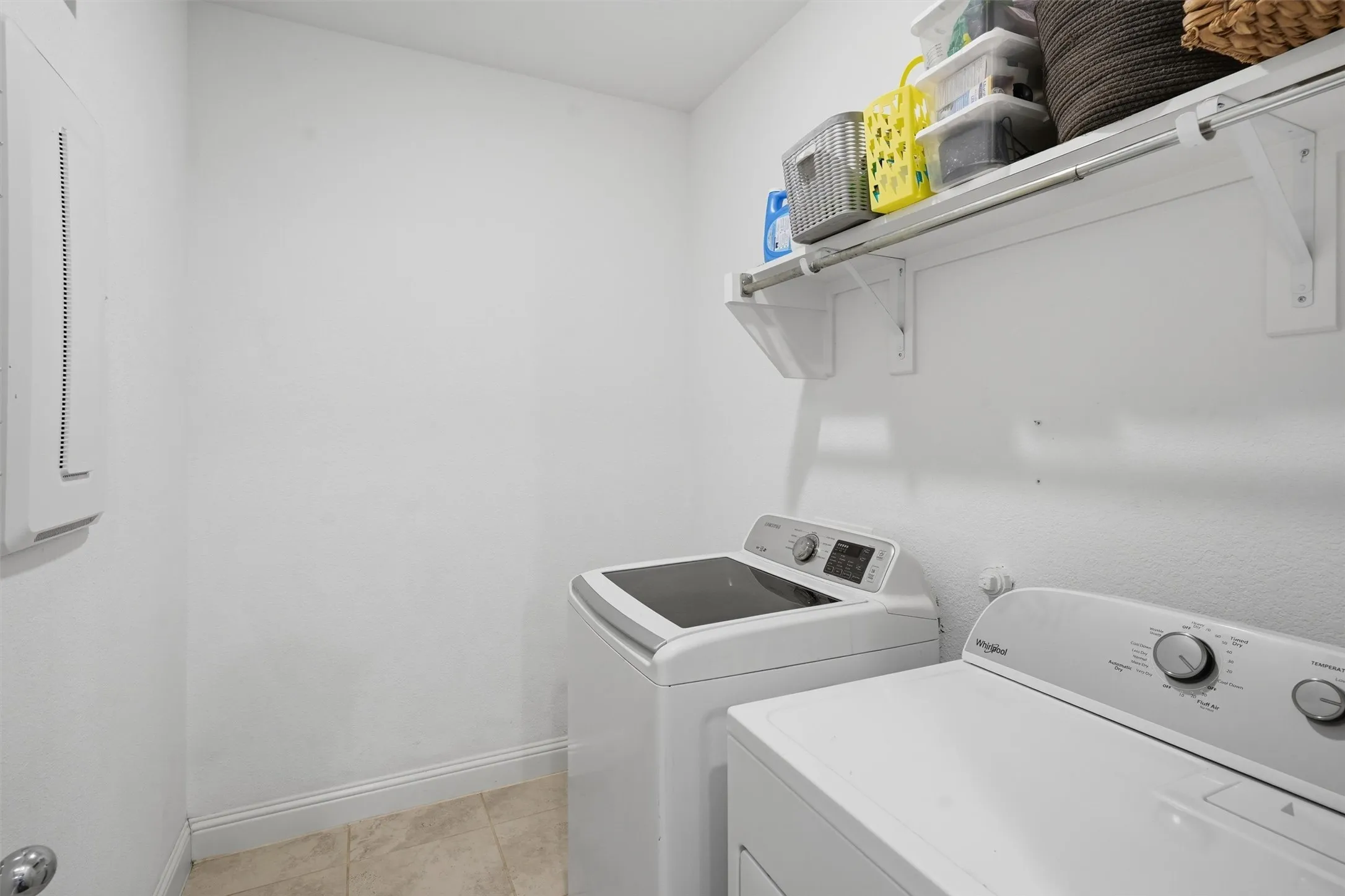 Large downstairs laundry room with extra room for storage