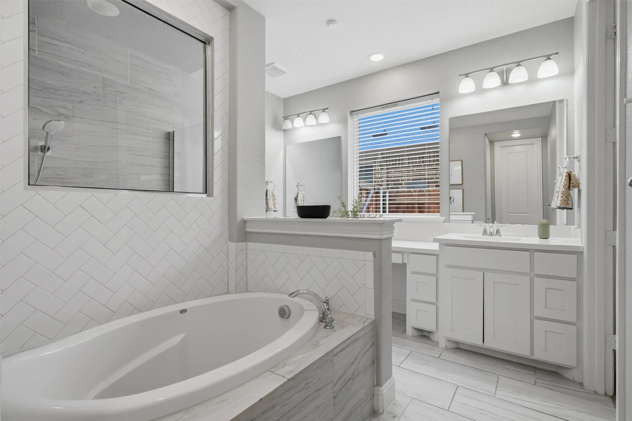 Thoughtfully designed primary bathroom layout built for both serene evening relaxing in the soaking tub and efficient morning hustle and bustle.