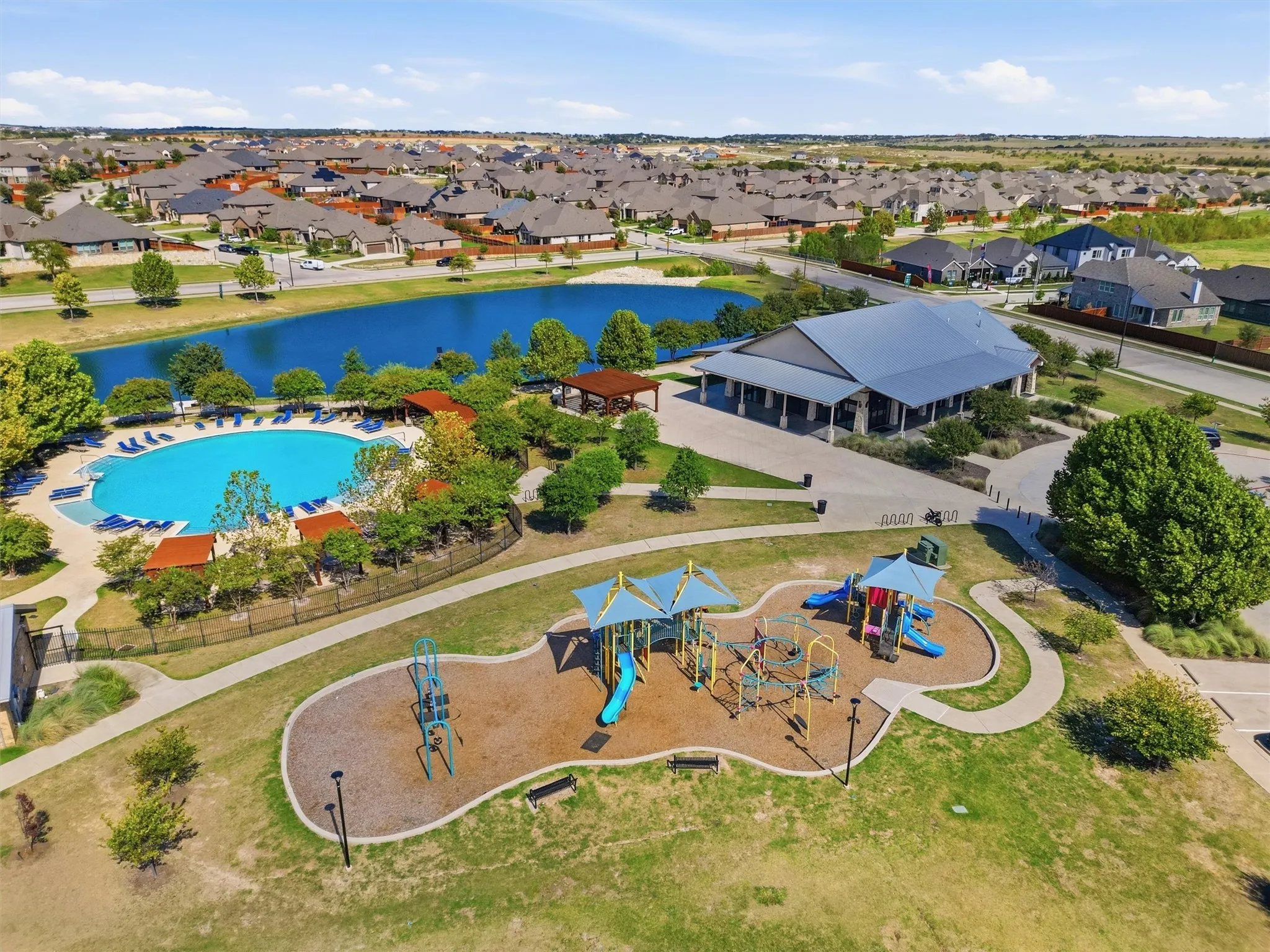 Aerial overview showcasing the expansive community amenity center designed to offer an active, family-friendly lifestyle right within the neighborhood