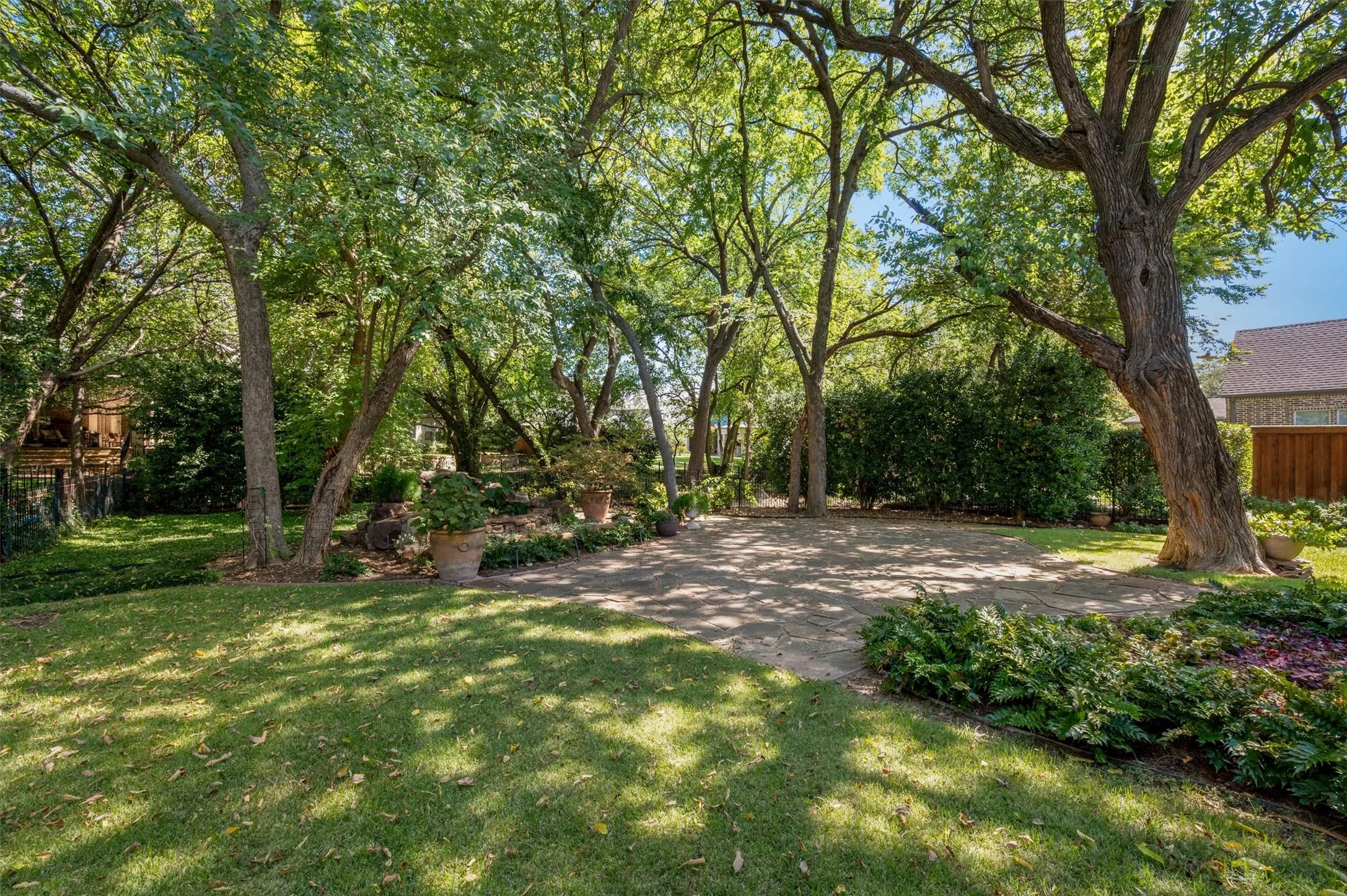 Heritage mature trees offer a shady respite and lush view.