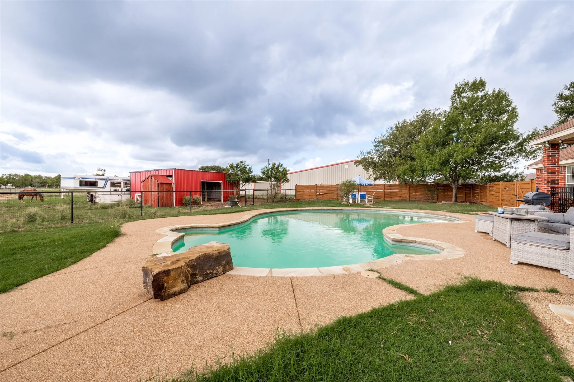 Plenty of room to swim, play, entertain, and let the kids run and enjoy the great outdoors. With two acres to spread out and a pool to enjoy, what more could you ask for in your own slice of country living?