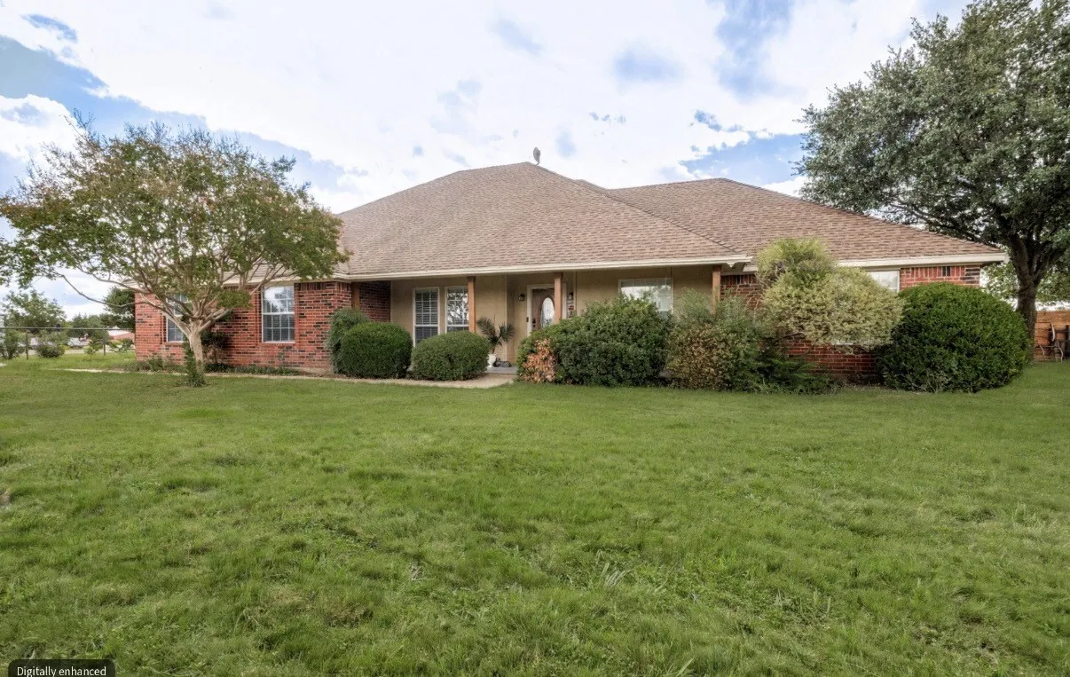 Charming and quaint, this inviting home sits comfortably back from the street, offering a peaceful setting with added privacy and the appeal of country living on two acres.