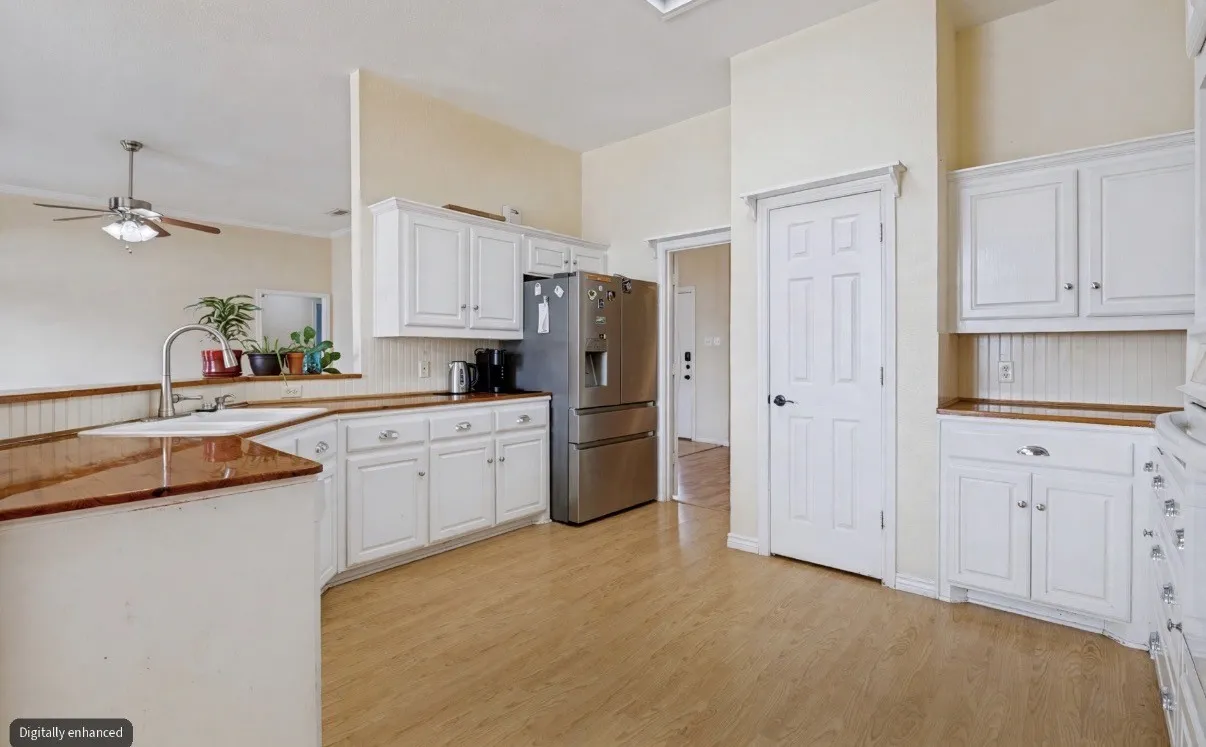 An open and spacious kitchen filled with natural light, offering a bright and welcoming atmosphere perfect for everyday living and gathering with family and friends.