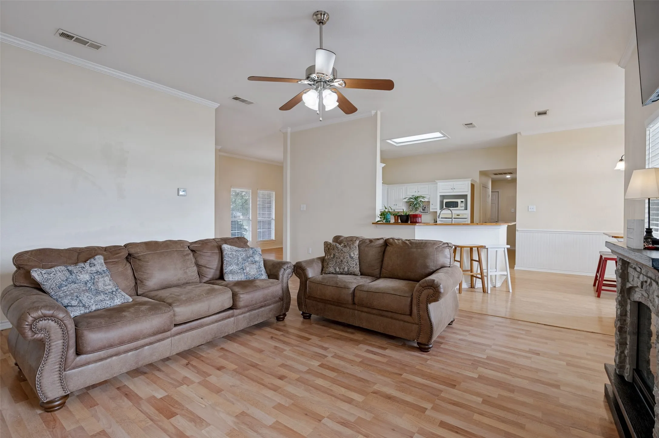 A spacious and inviting living area filled with natural light, creating a warm and comfortable atmosphere perfect for relaxing, entertaining, and enjoying everyday moments at home.