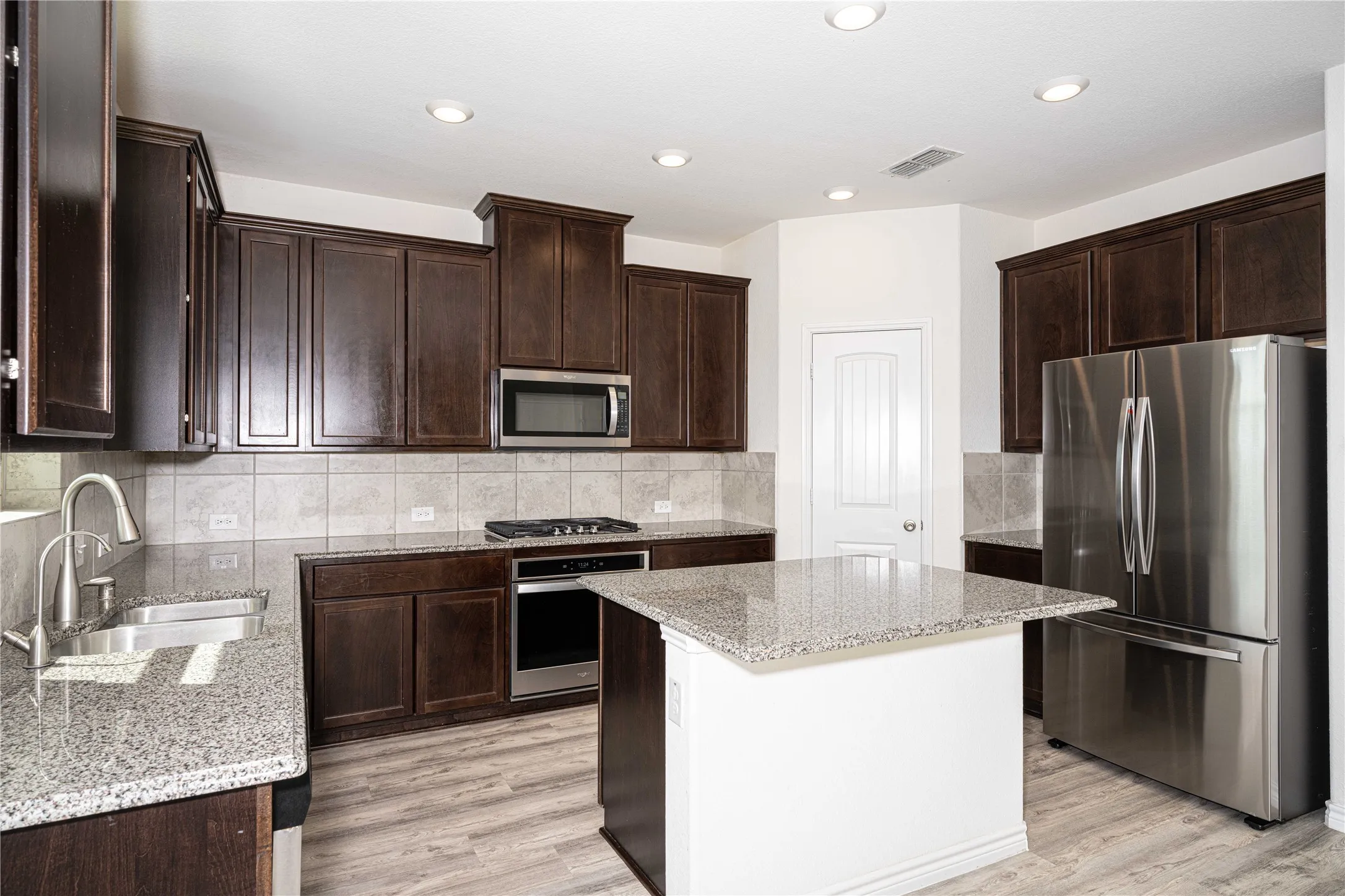 Spacious Kitchen with Stainless Steel Appliances, Granite Counter Top & Island
