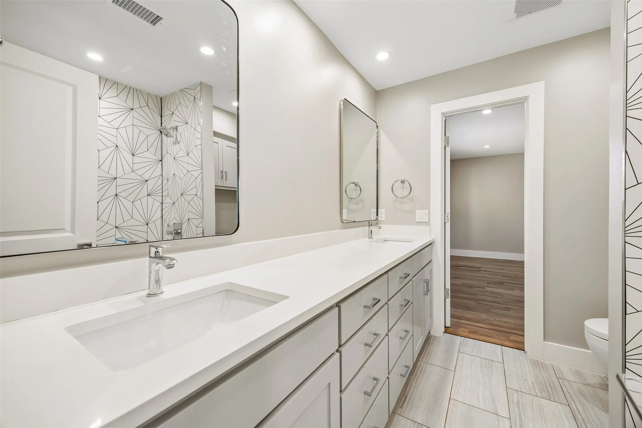 Jack and Jill, Dual-sink vanity with designer shower tile