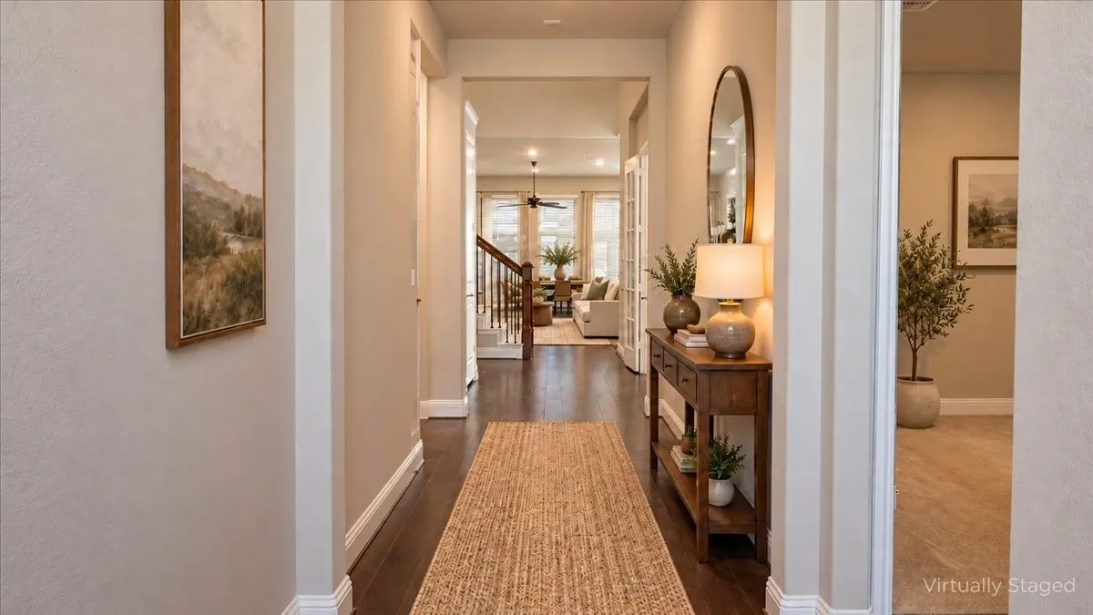 Entryway featuring wood-finish flooring, neutral wall tones, and recessed lighting
