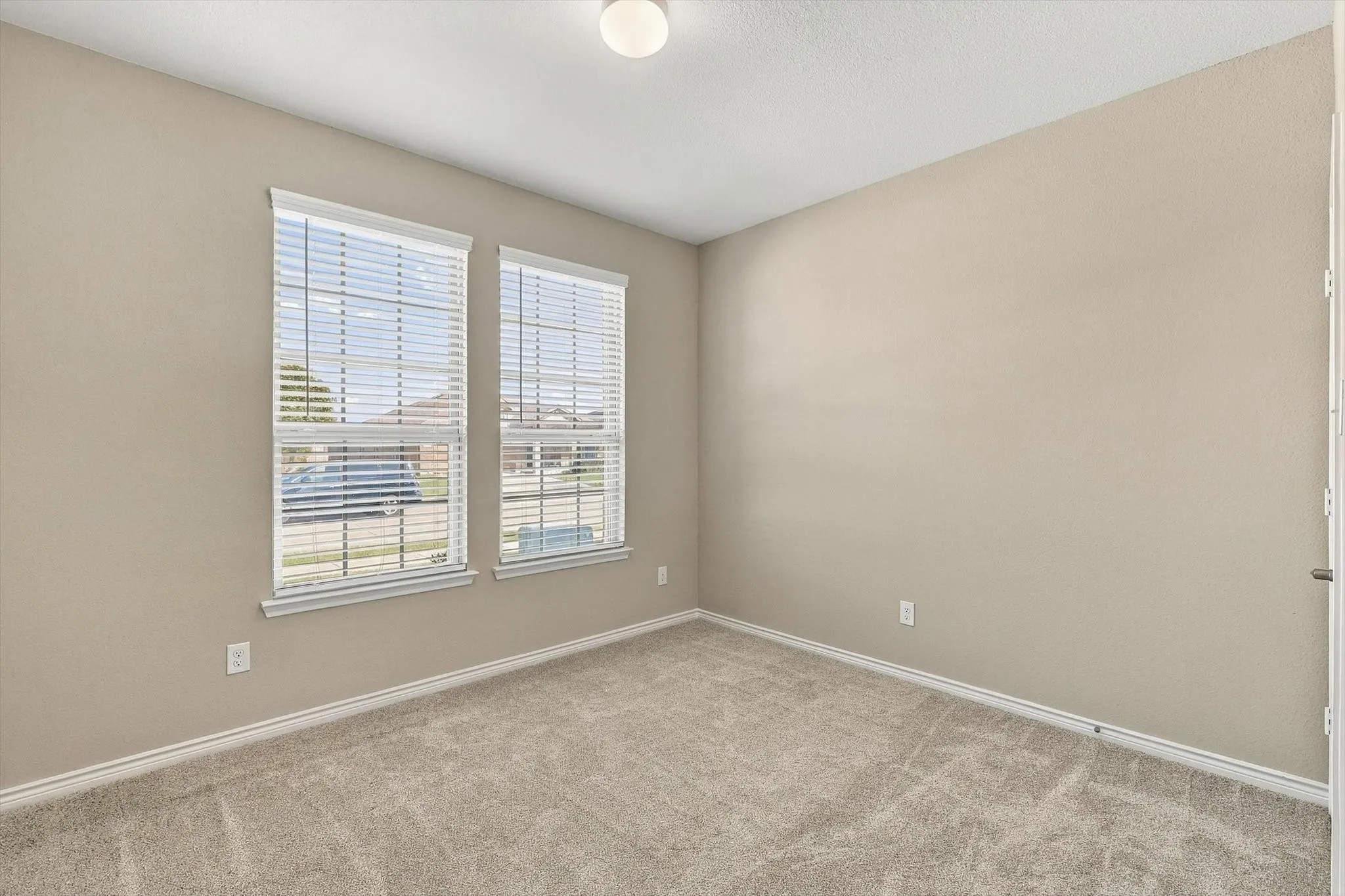 Bedroom 2 located in the front of the house.  Freshly painted and new carpet.