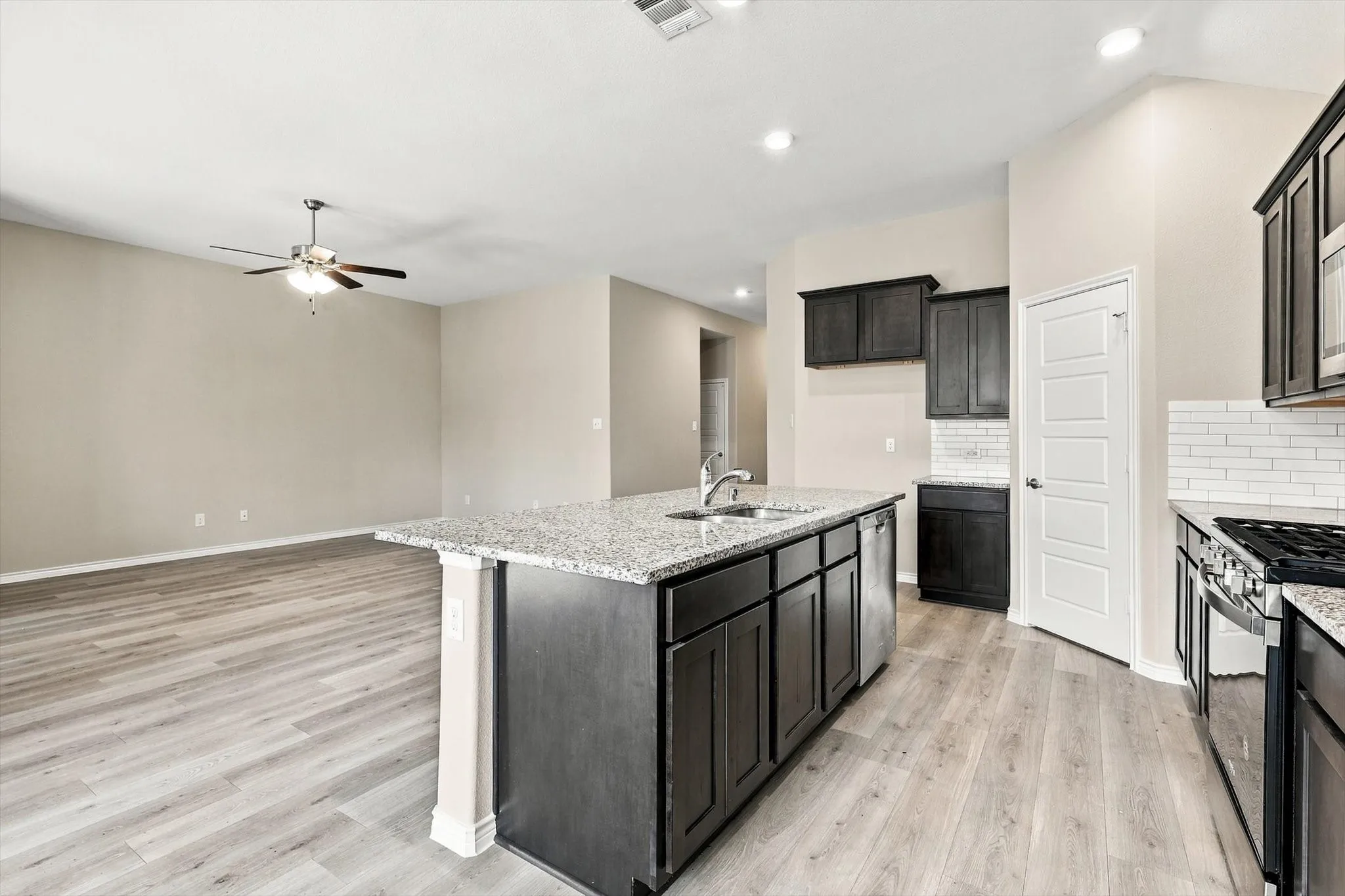 Another view of the open concept.  The large island  allows for a lot of workspace.