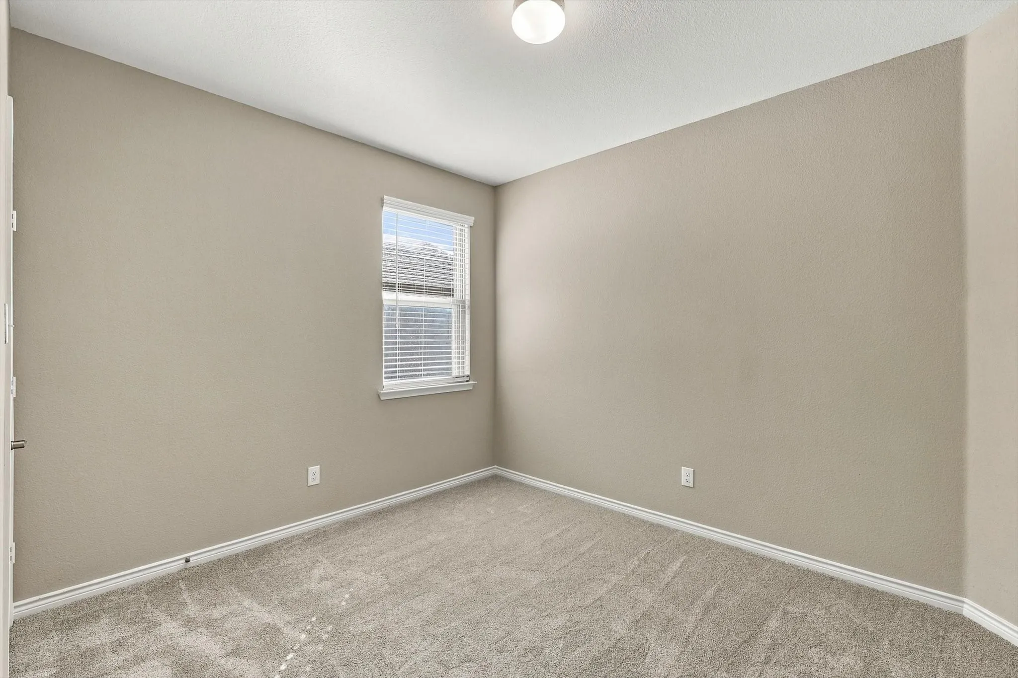 Bedroom 3 with fresh paint and new carpet.