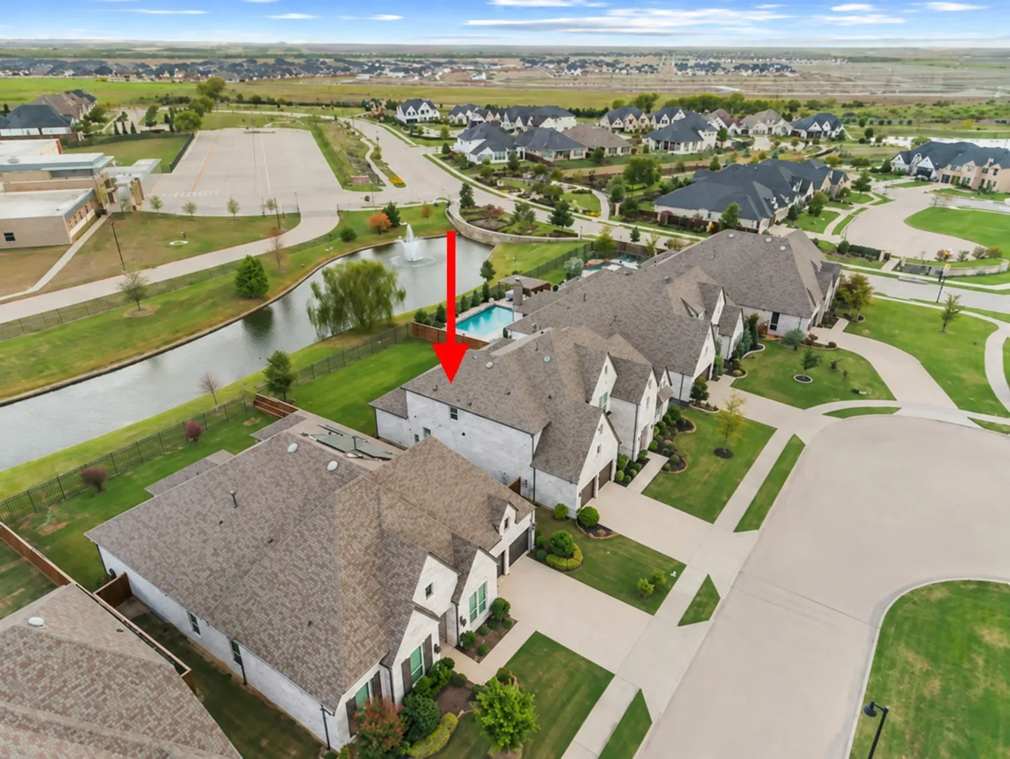 Oversized lot backs up to fountain pond.