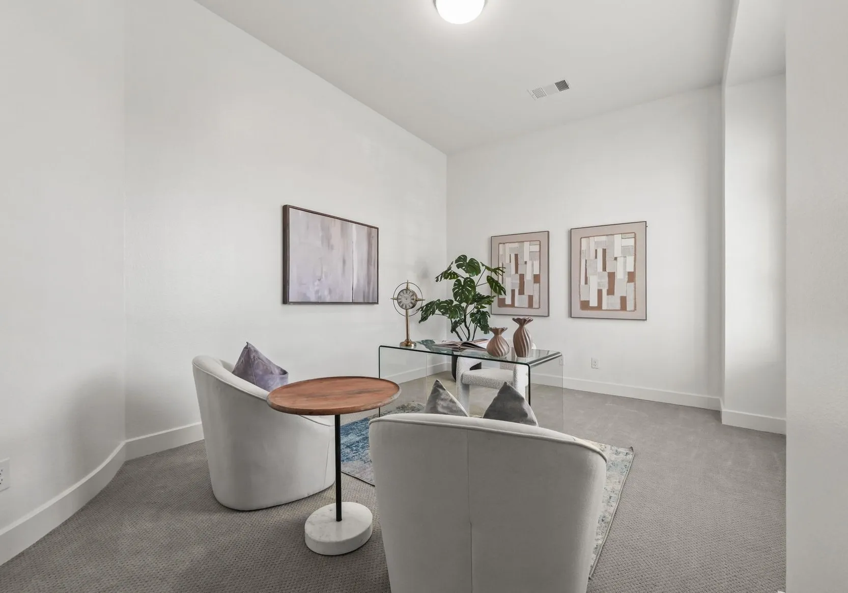 Interior room featuring high ceilings, neutral wall tones, and neutral-toned wall-to-wall carpeting