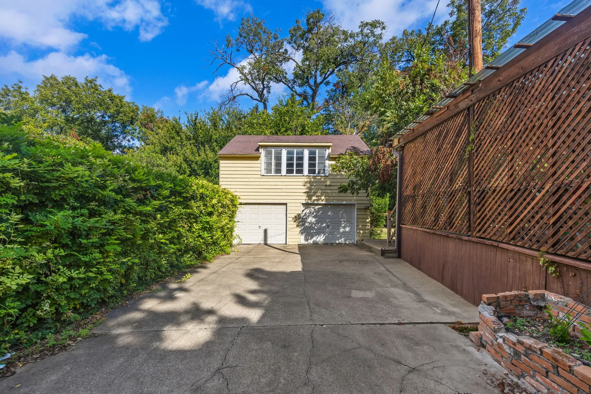 Long Driveway leading to detached garage.
