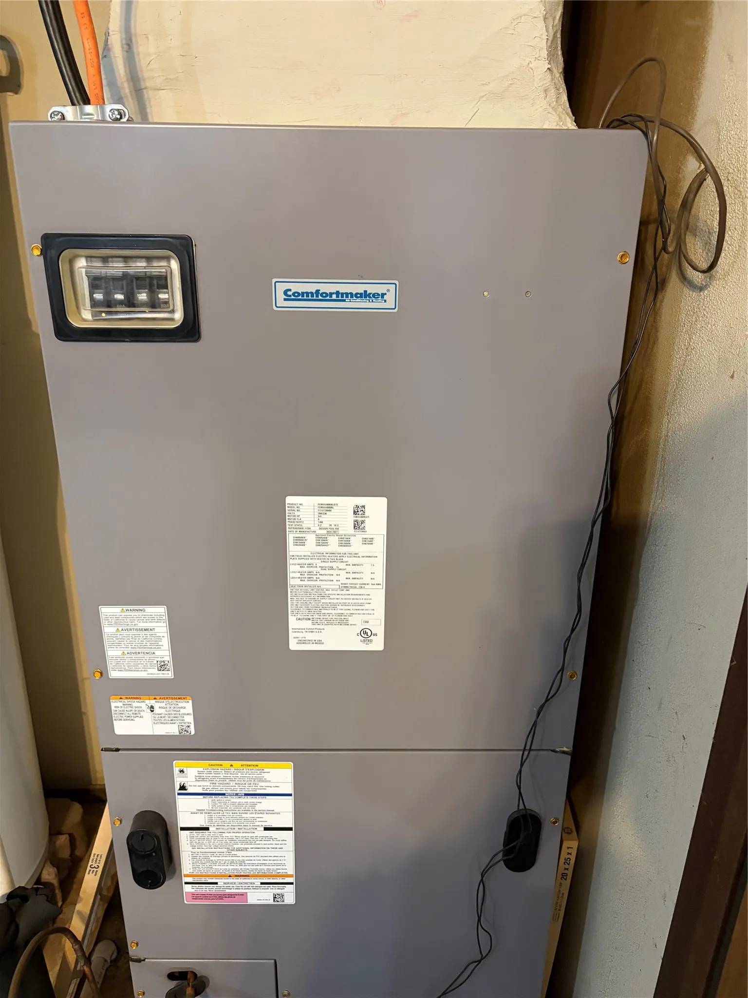 Comfortmaker air handler unit featuring a neutral grey metallic finish and an integrated electrical disconnect box