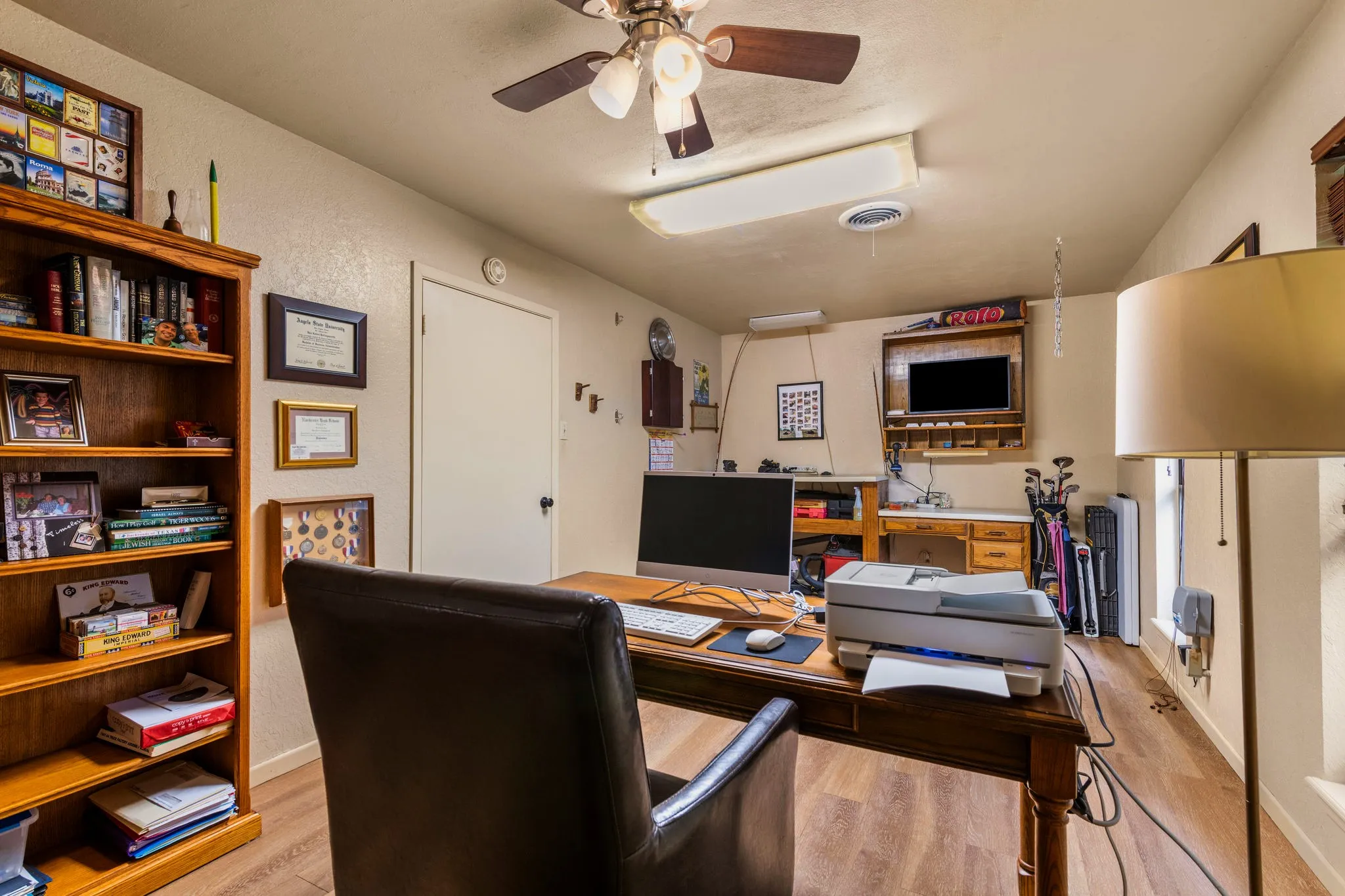 A built-in work counter and display shelving give this flexible room endless purpose: home office, hobby studio, craft room, or overnight quarters.
