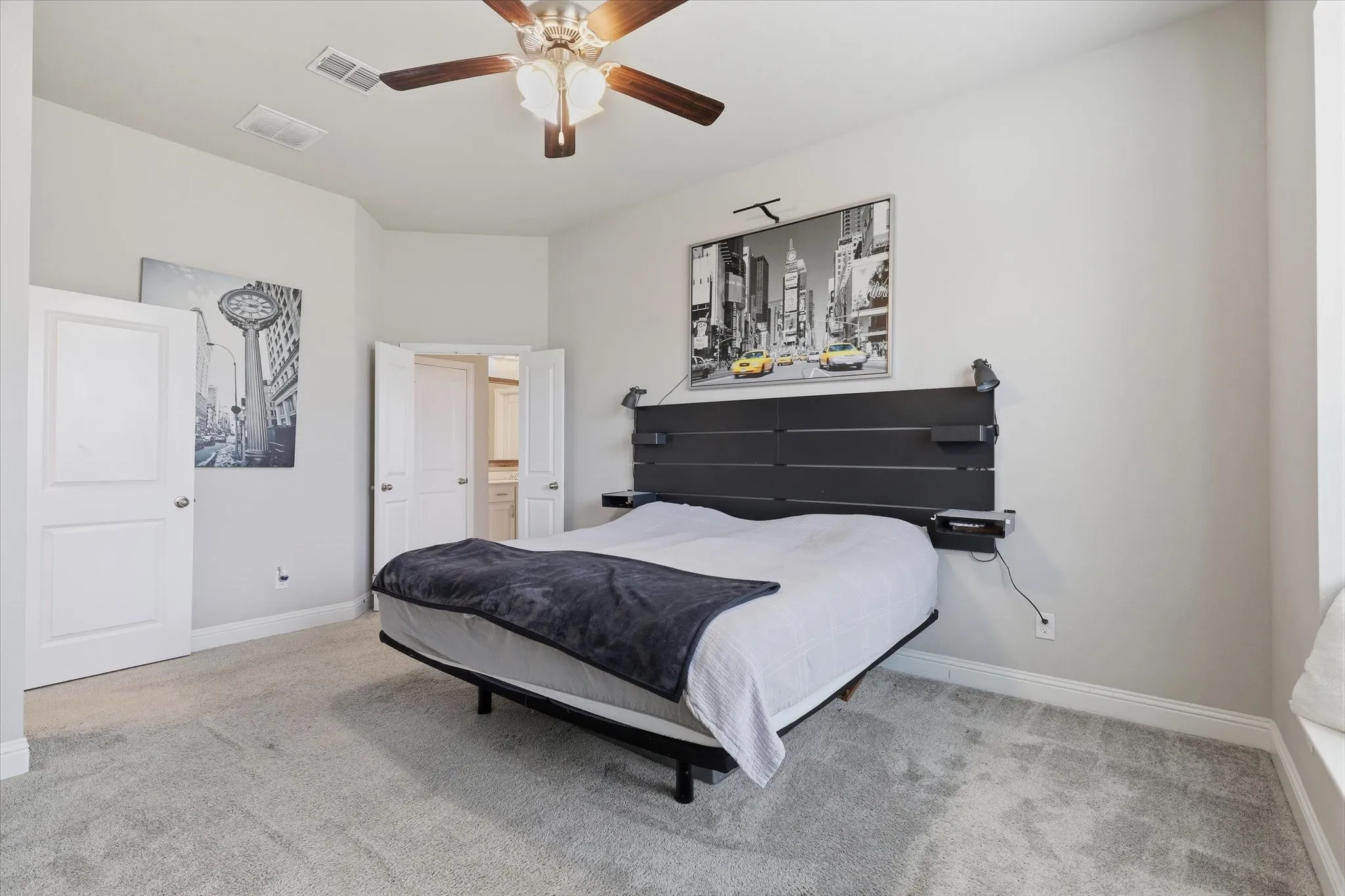 Private primary bedroom with space for reading chair and oversized furnishings.