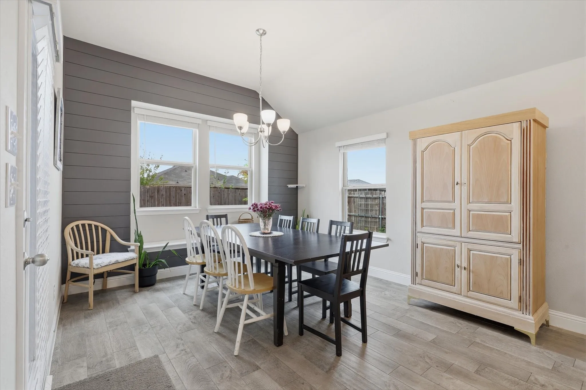 Custom wall feature in dining space, decorative lighting  and natural light make the dining area a standout!