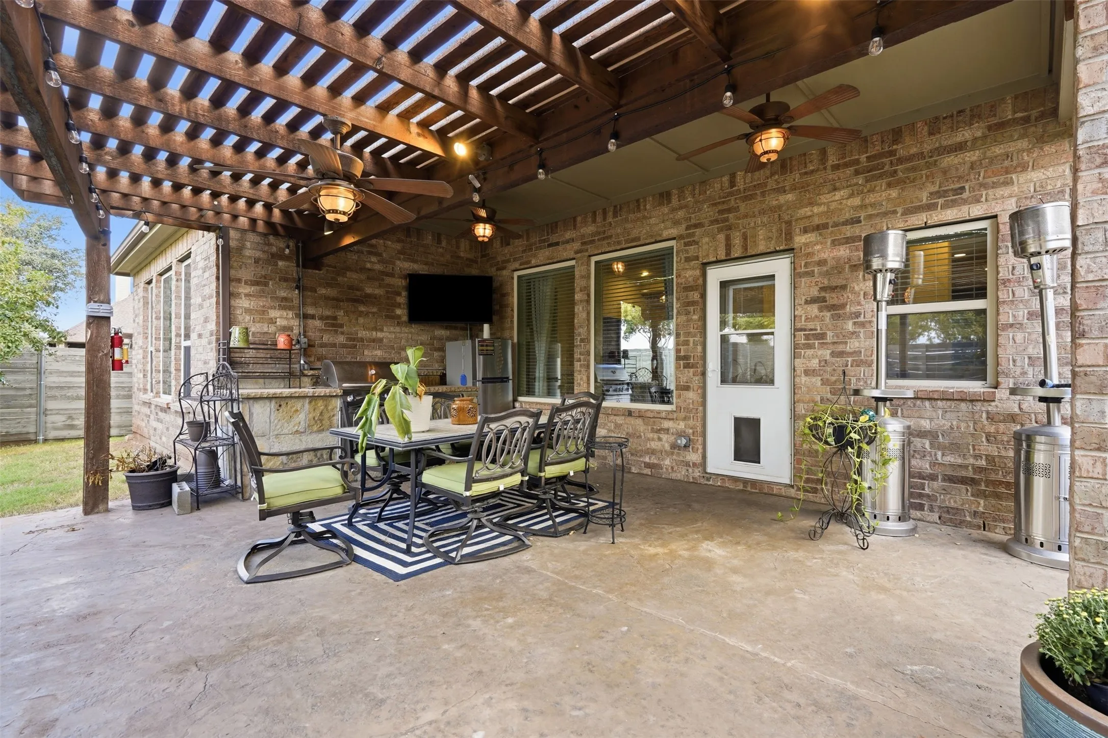 Great for outdoor dining and entertaining. Featuring built in grill, fridge and TV!