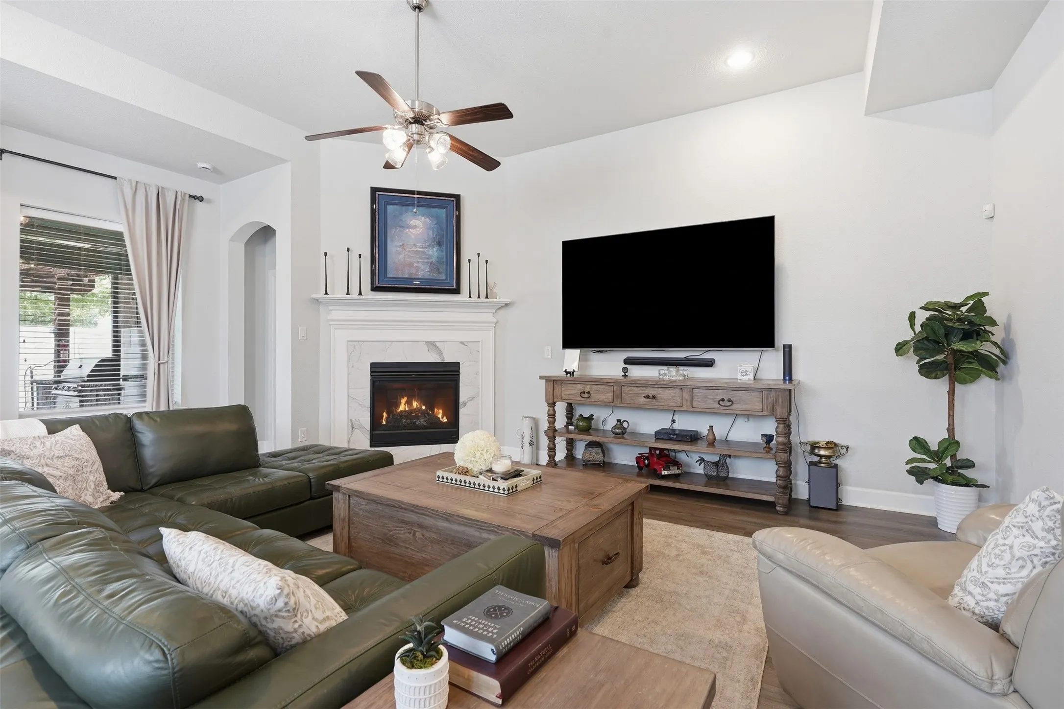 Gas log fireplace with a mantle. Wired to hang your TV
