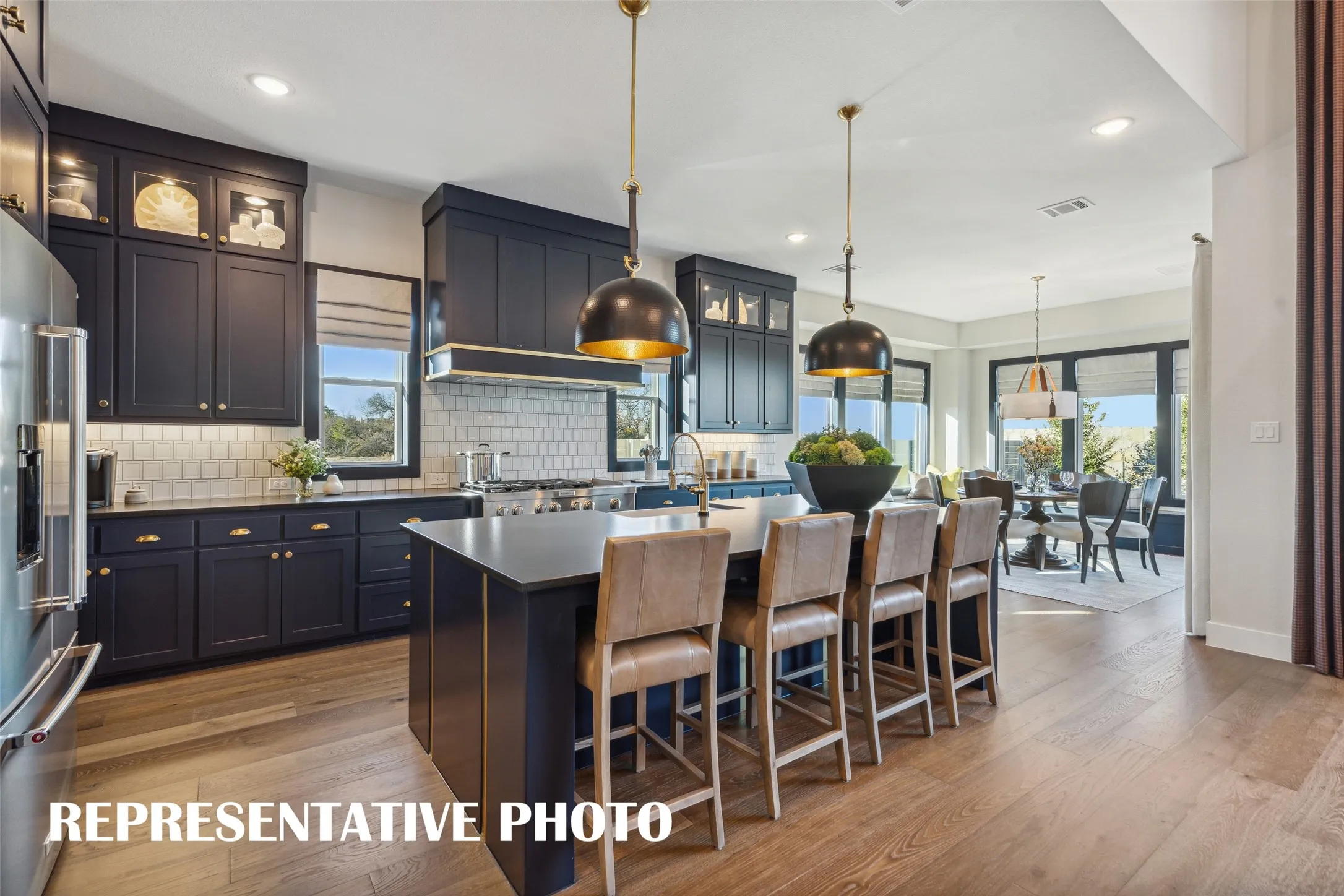 Featuring a chef's dream kitchen that is open to the family and dining rooms, entertaining is a breeze in our Madison II floor plan.  REPRESENTATIVE PHOTO