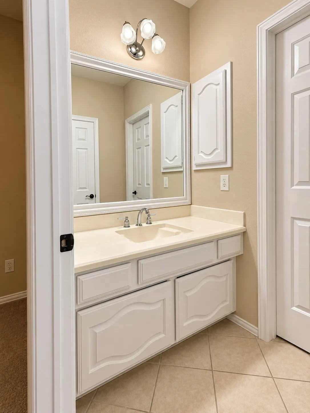 Vanity with an integrated sink, polished chrome faucet, and ample storage