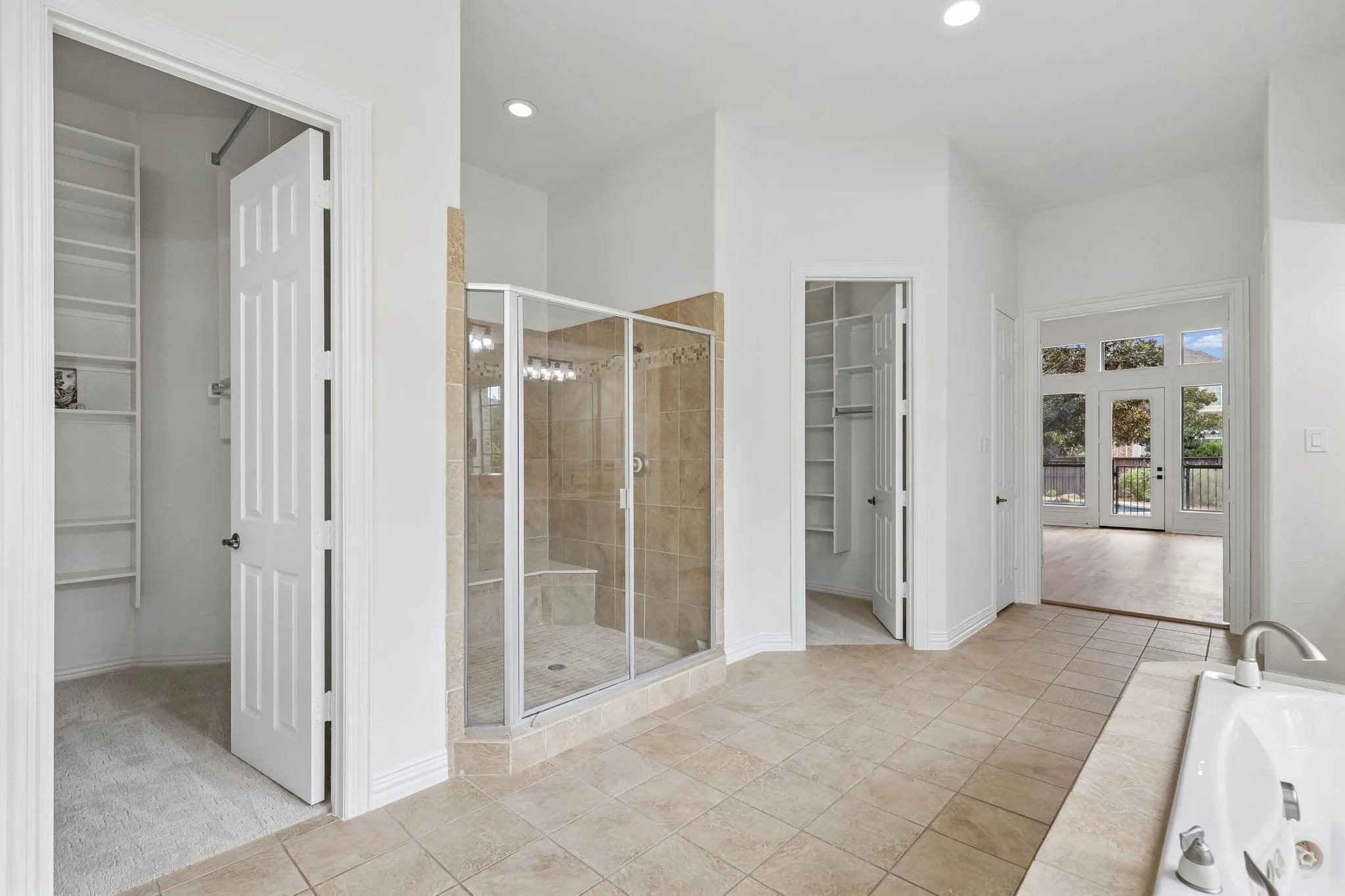 Ensuite bath includes 2 spacious walk-in closets in addition to a linen closet.