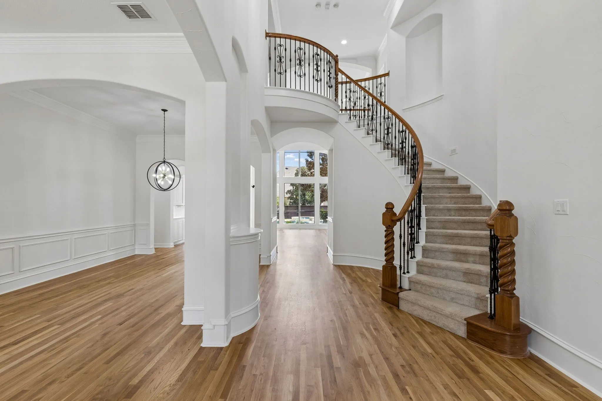 Inside, the home unfolds w an air of elegance with fresh paint, carpet and white oak hardwood floors.
