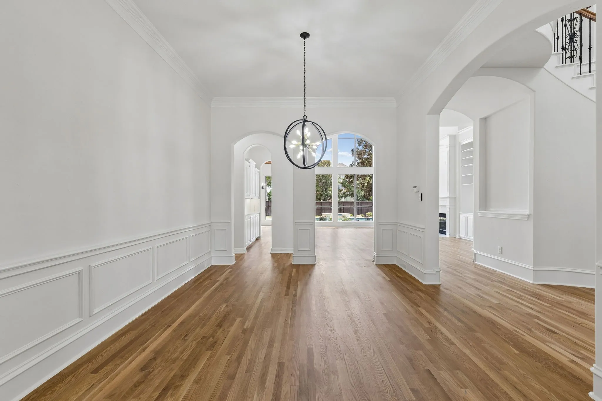 Formal dining is adjacent to a bar - butlers pantry with sink making it easy to top off refreshments.