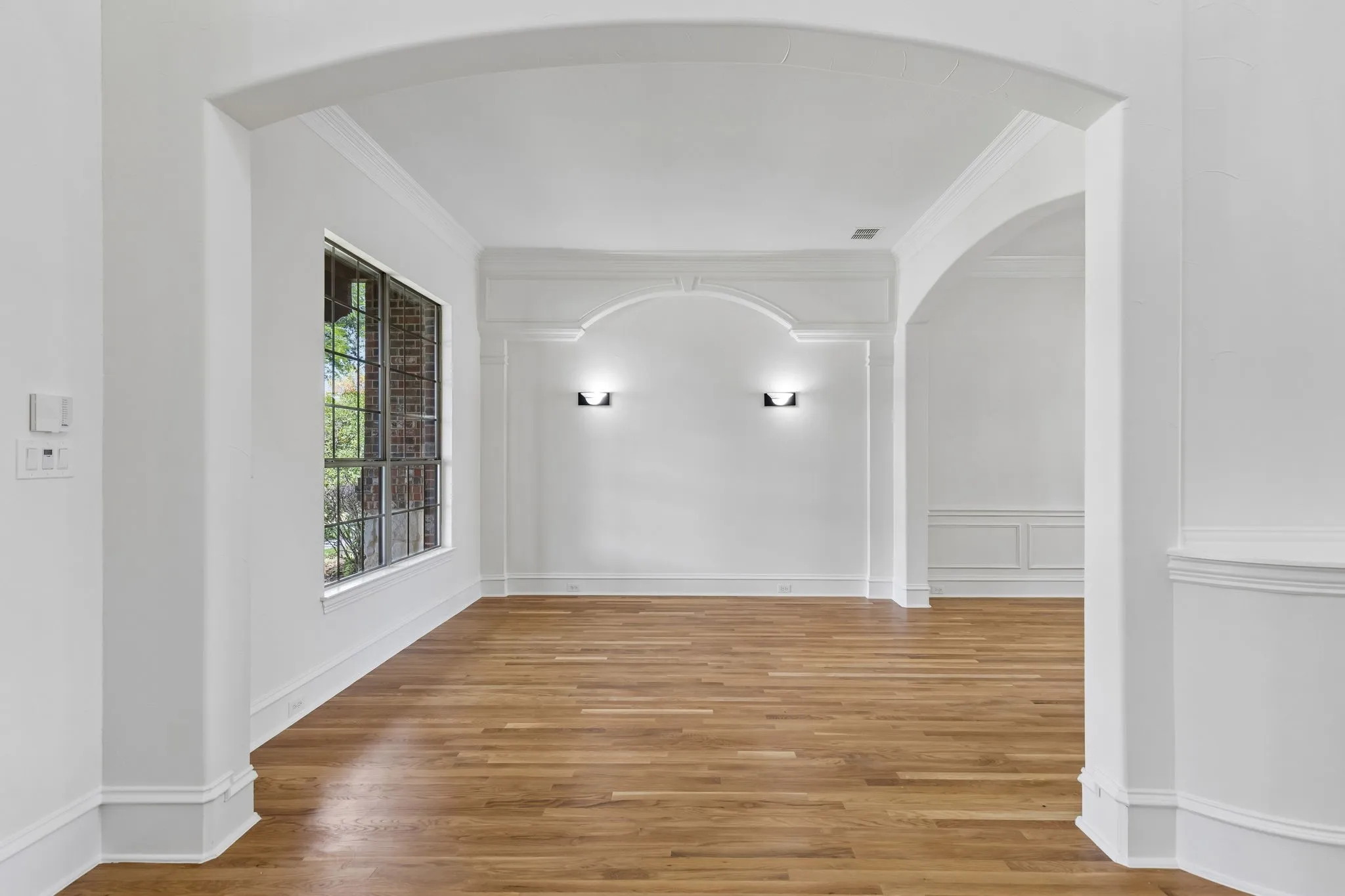 Formal living room for hosting guests, quiet reading, or as a sophisticated space for conversation and relaxation.