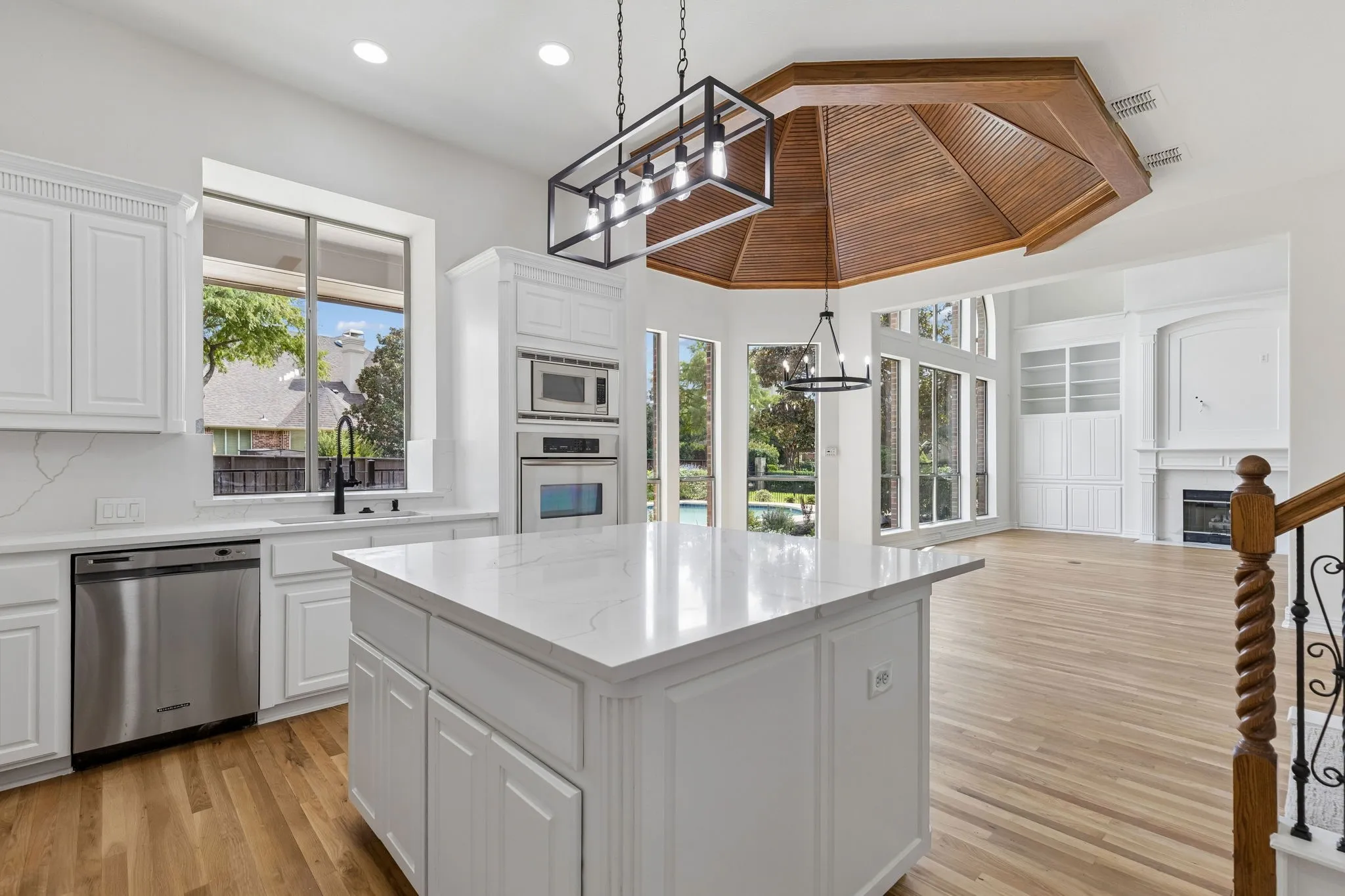 The kitchen includes stainless steel appliances new black faucet and lighting.
