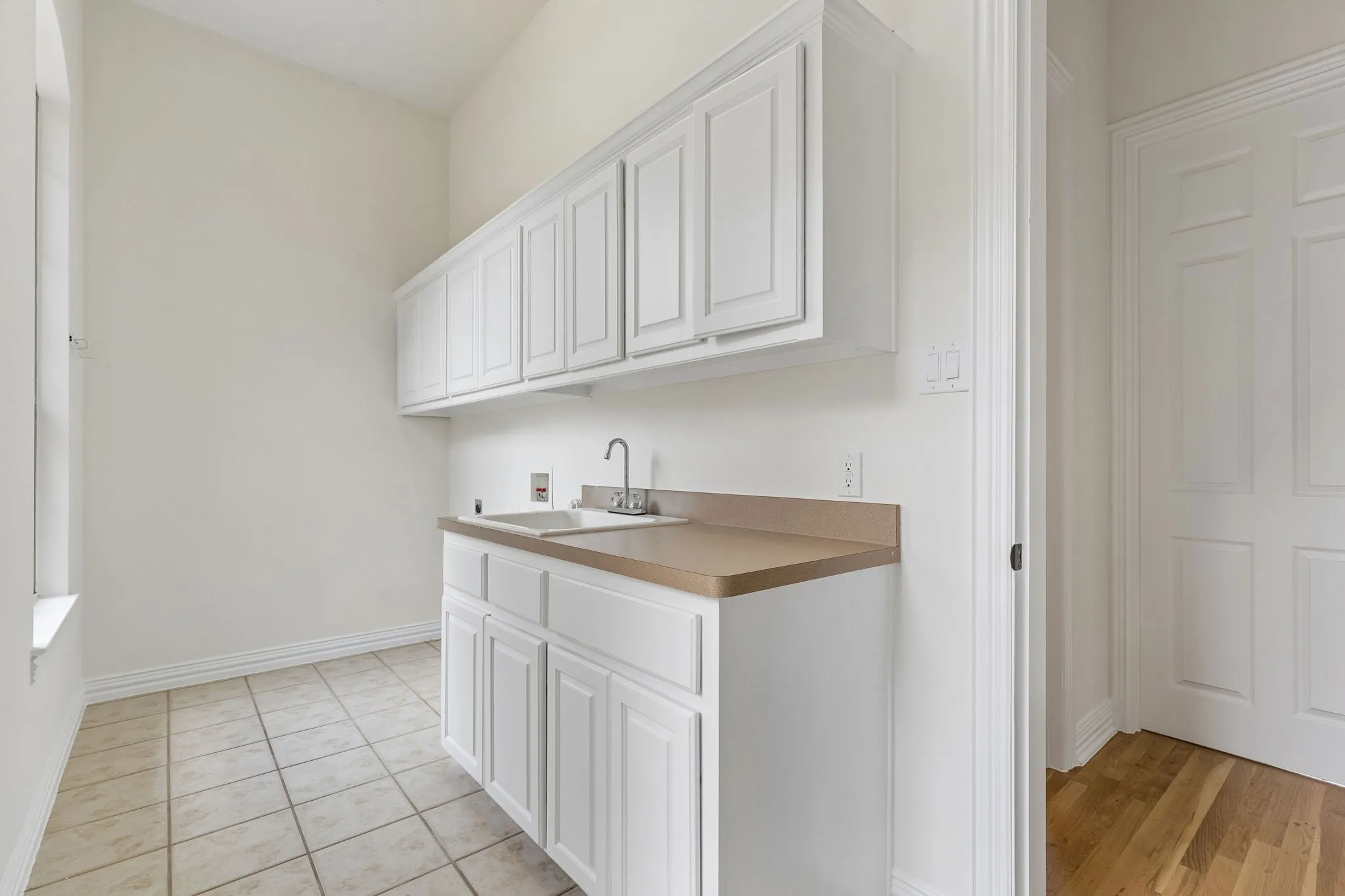 Laundry is down with sink, built in cabinets and room for full size washer/dryer.
