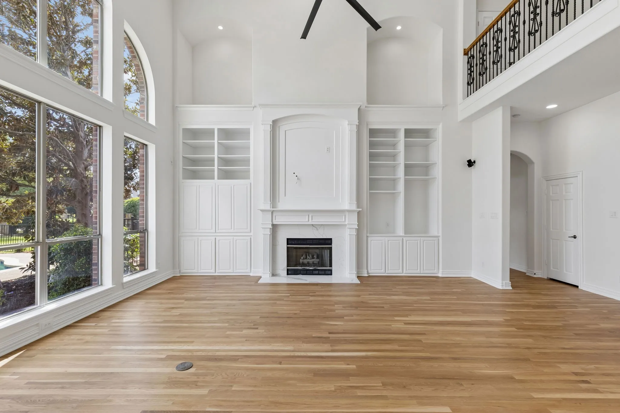 Family room equipped with convenient built-ins and gas fireplace.