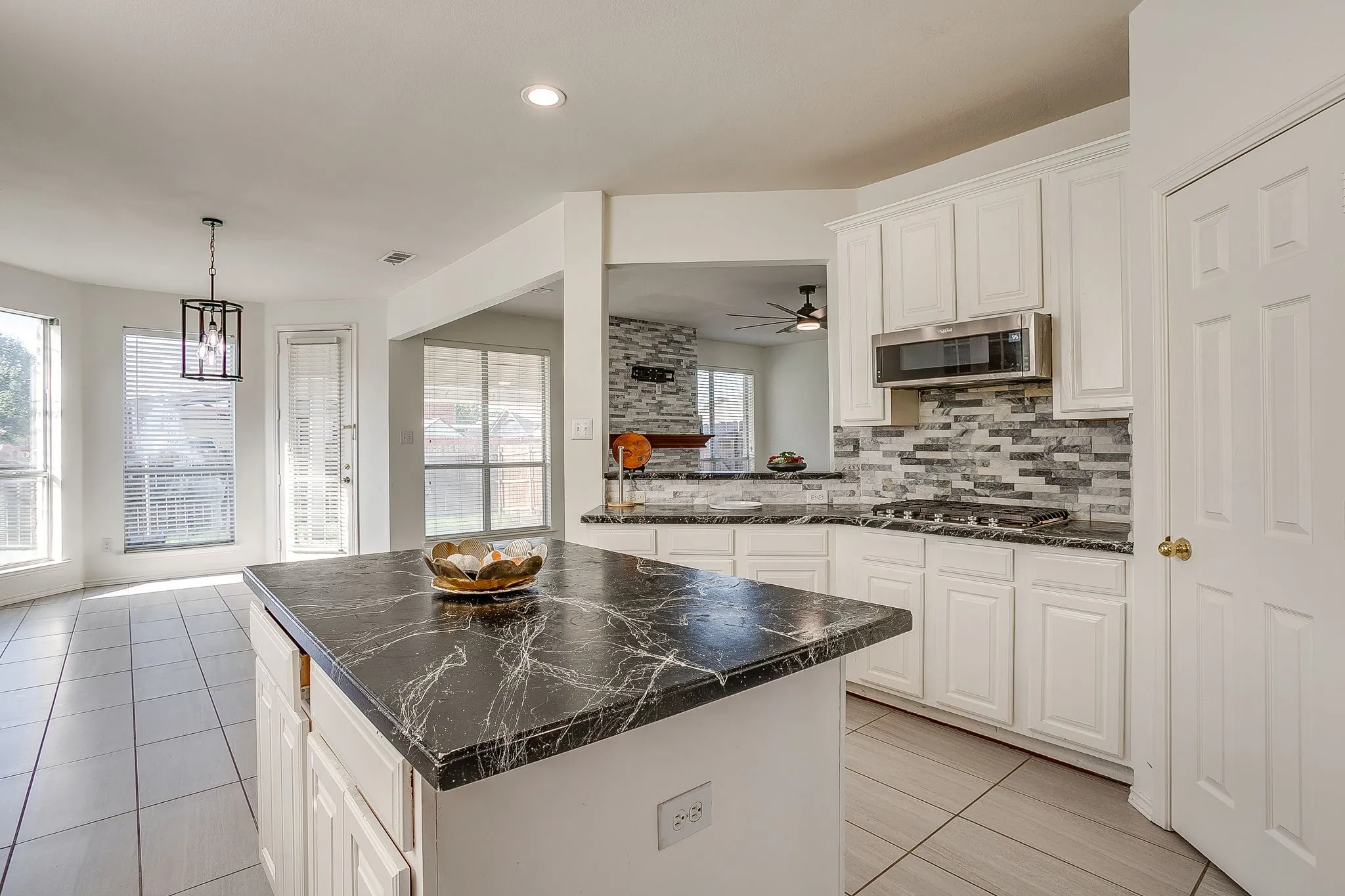 Kitchen recessed lighting and double sink.