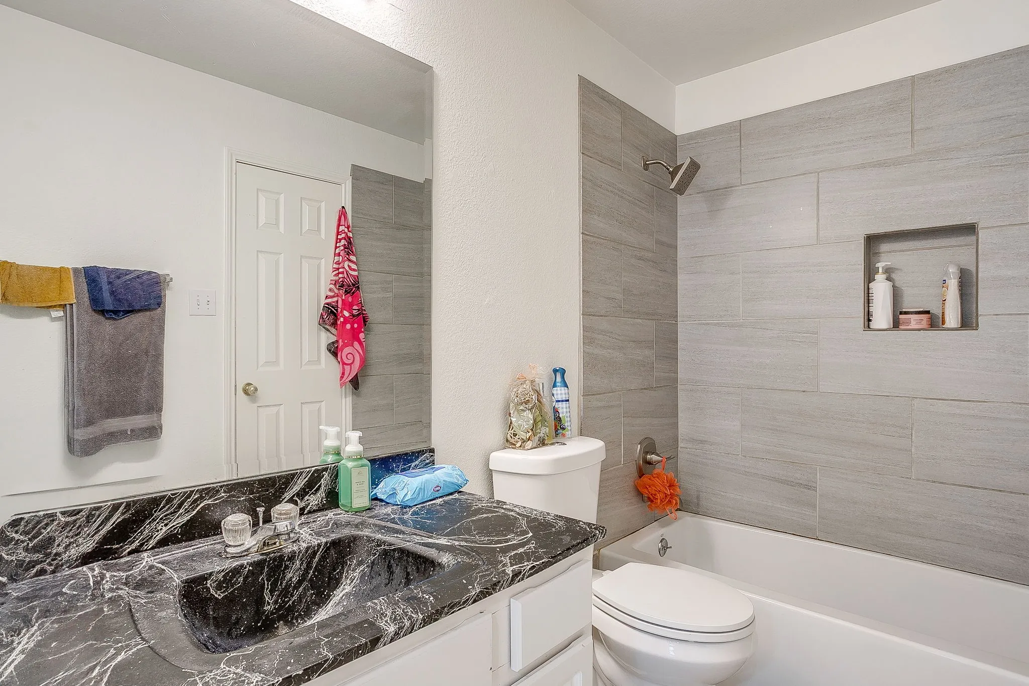 Bedroom #3. Vaulted ceiling  & ceiling fan. Shared Jack and Jill bathroom
