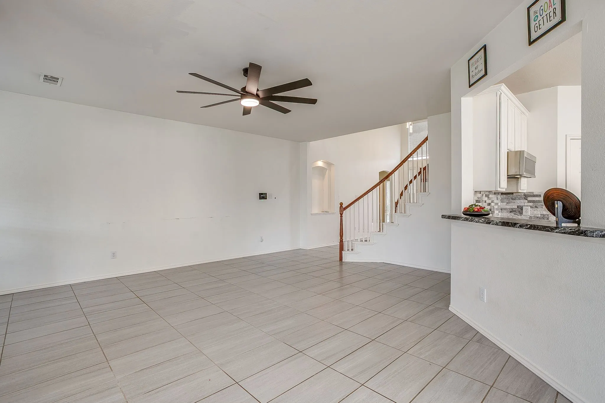 Floor to ceiling fireplace. Virtually staged
