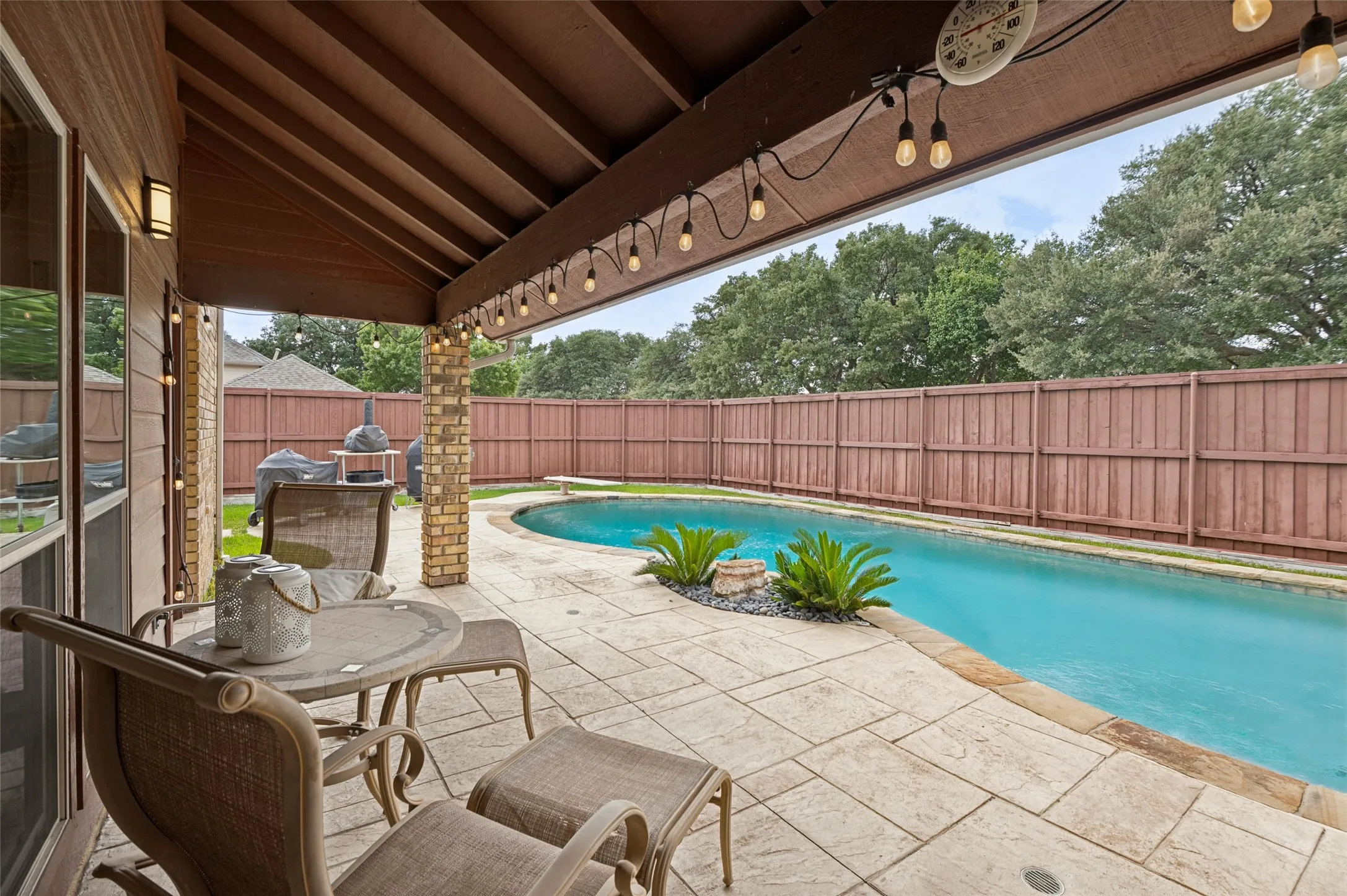 Covered patio area overlooking the pool
