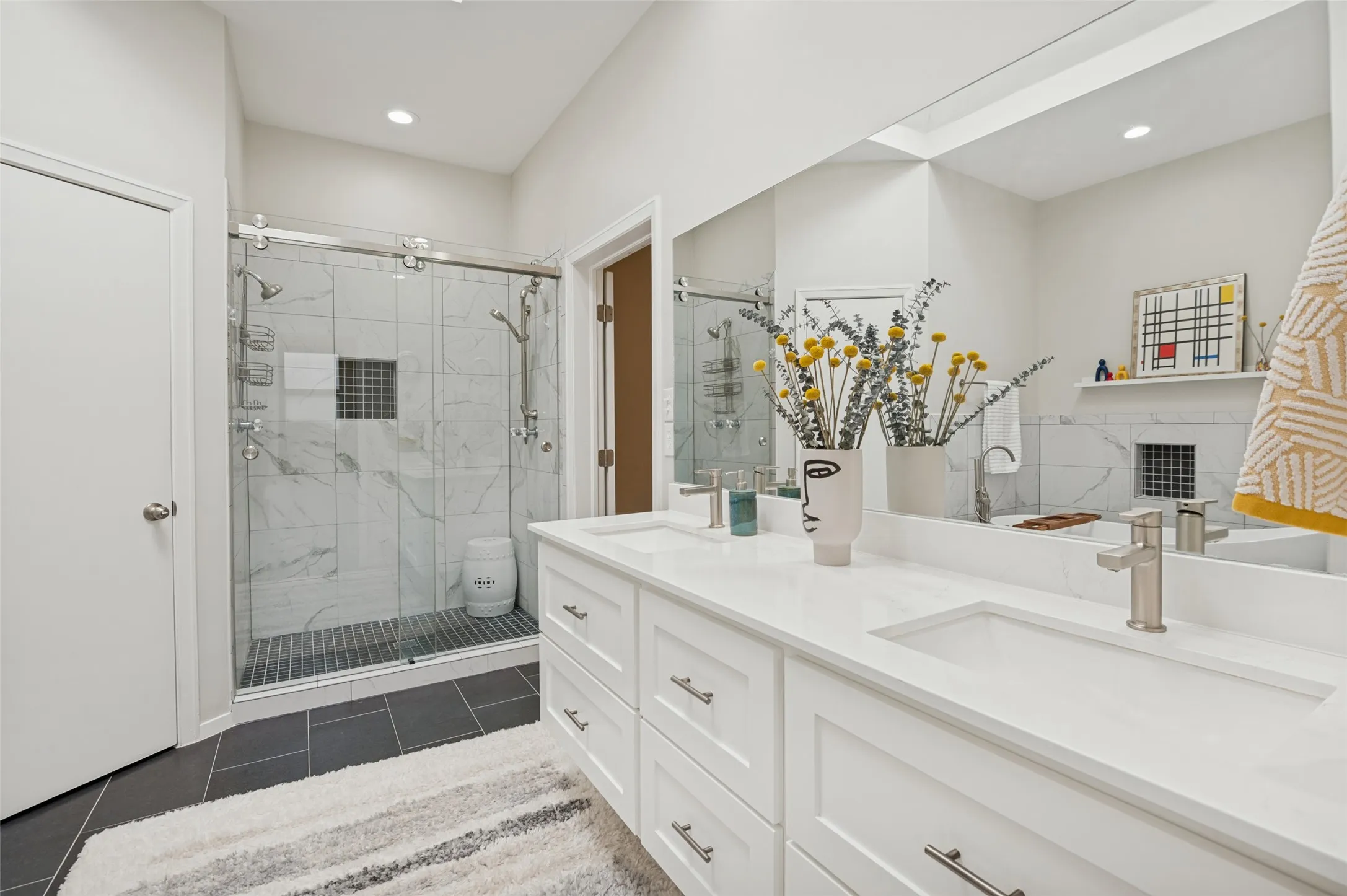 Primary bathroom with double shower and duel sinks