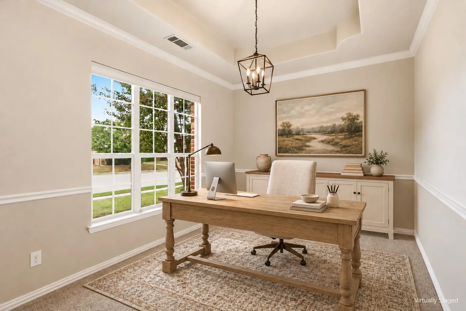 Tray ceiling featuring crown molding, large divided-light window, and metal geometric pendant lighting