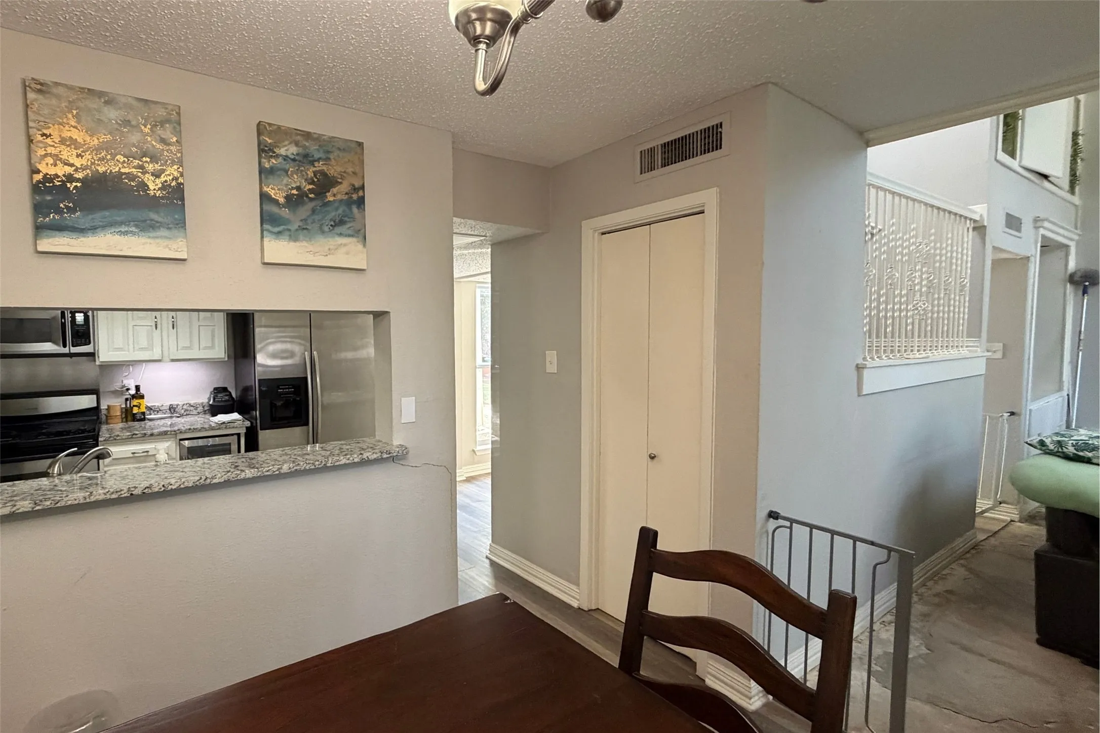 Dining Area with View of Kitchen and Living Area