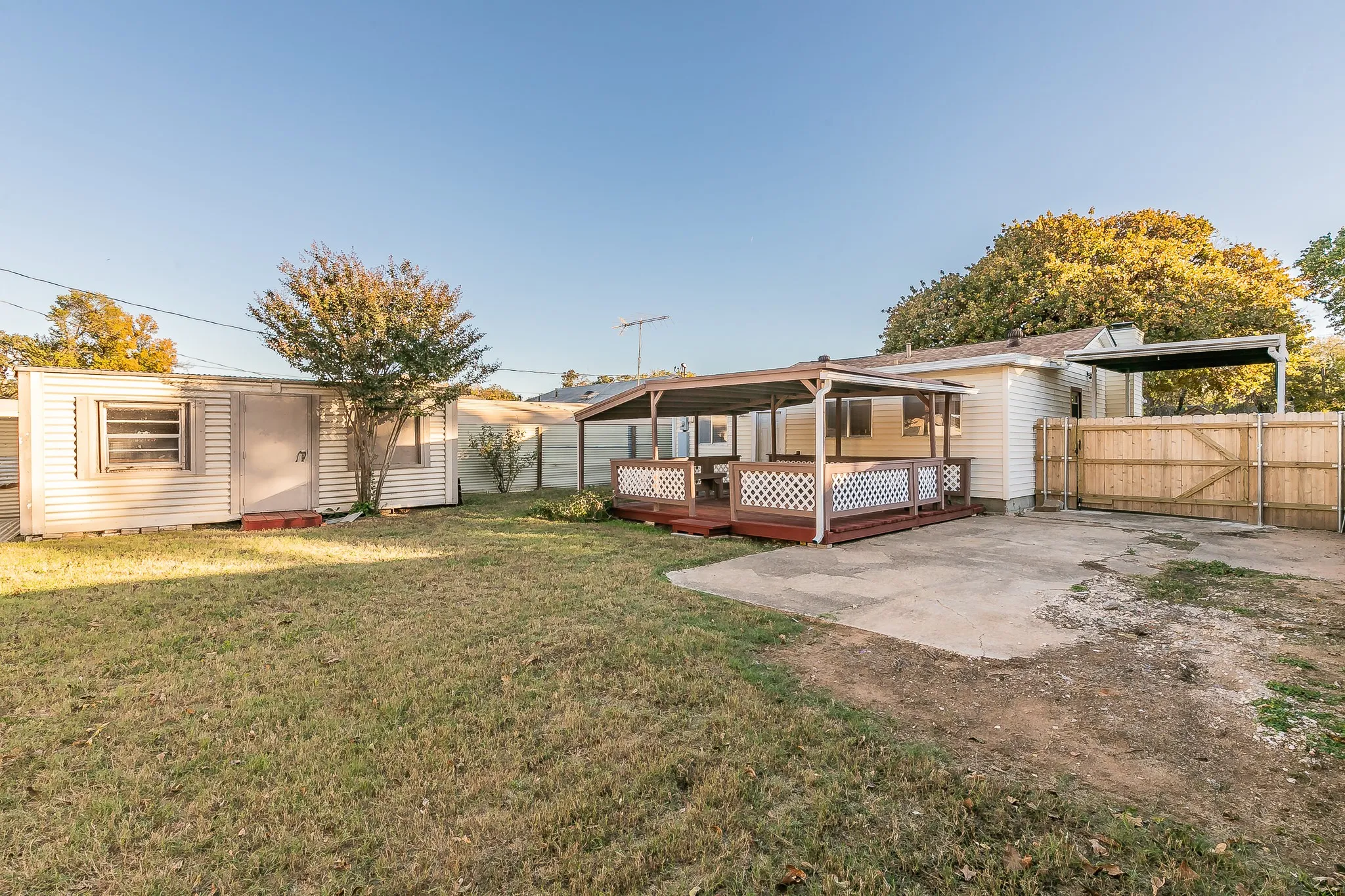 View of yard with a wooden deck